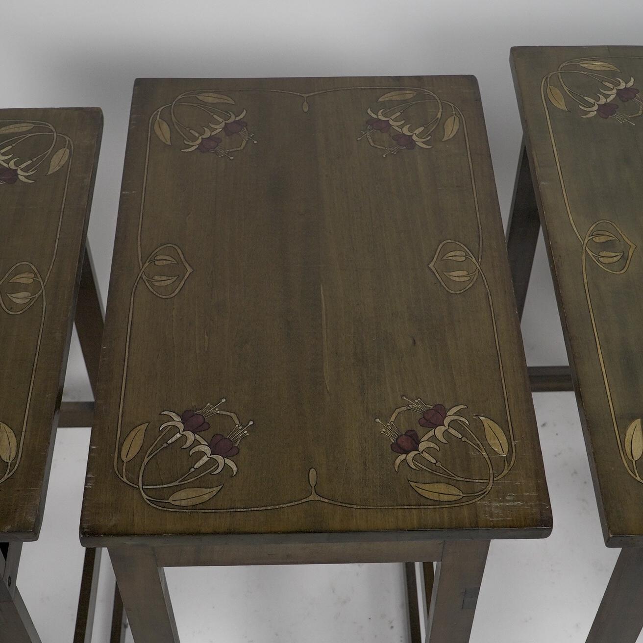 A nest of four side tables each top surface hand painted with floral decoration. For Sale 8