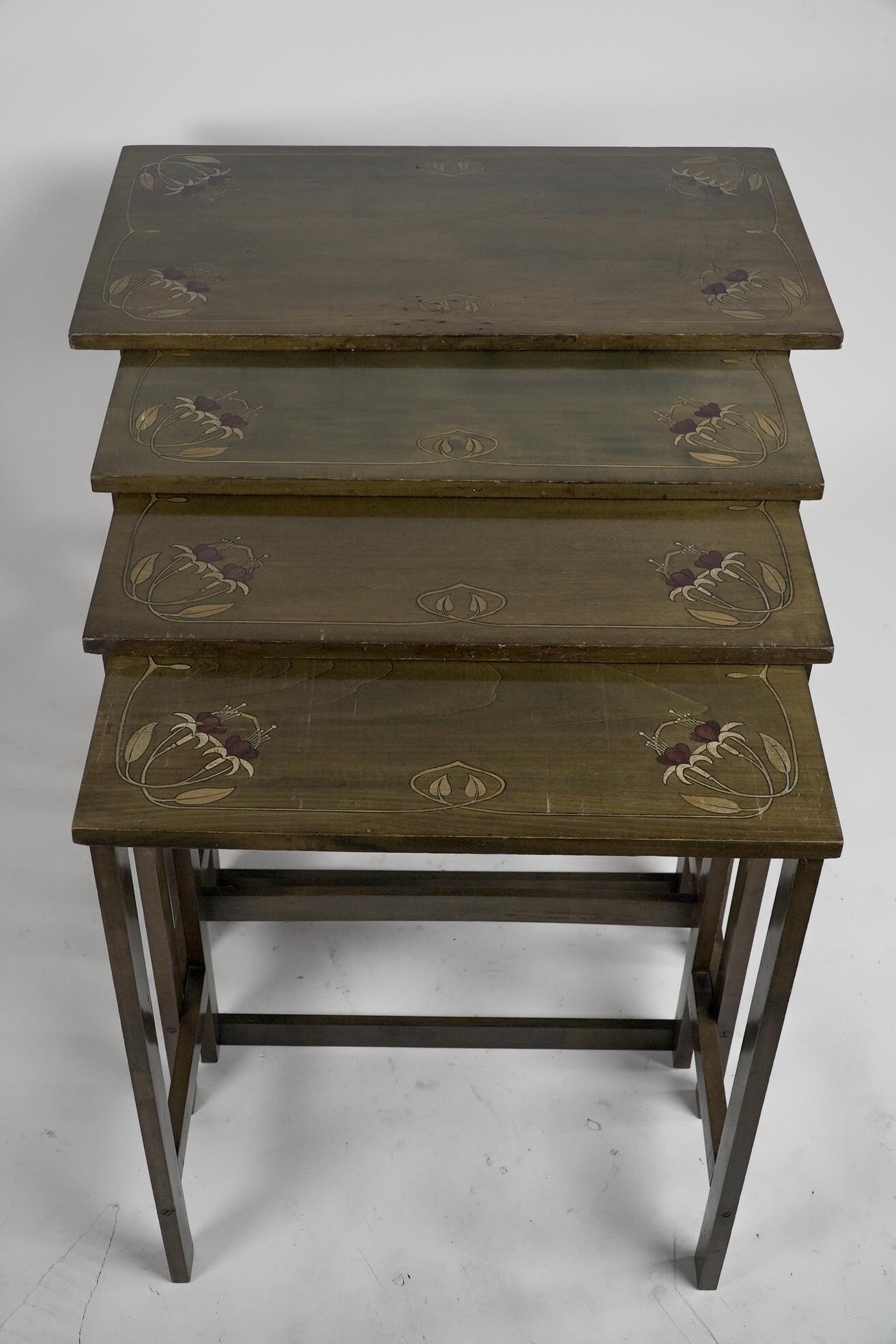 English A nest of four side tables each top surface hand painted with floral decoration. For Sale