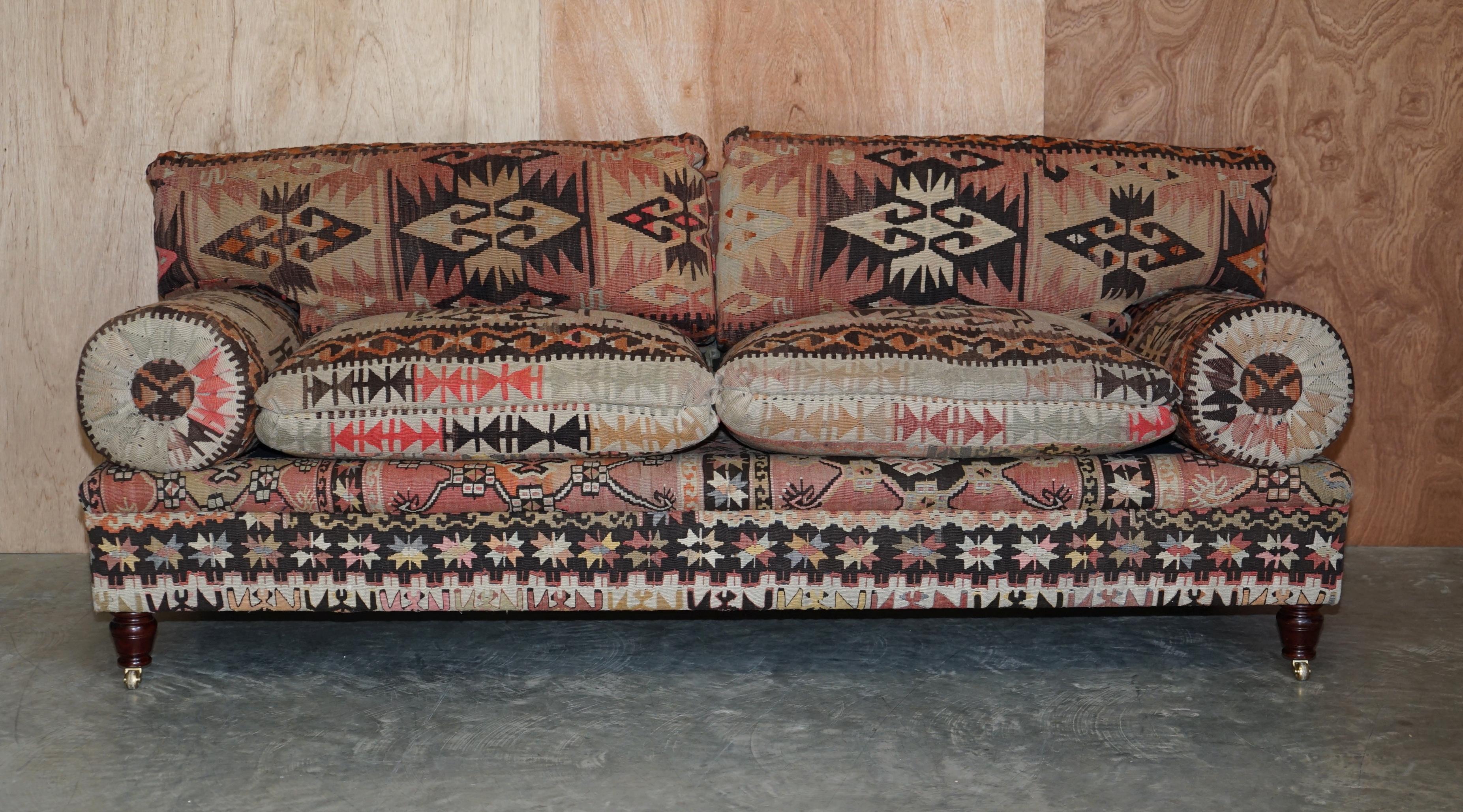 We are delighted to offer this sublime and highly collectable (part of a suite) New Old Stock George Smith Bulster or Bluster arm sofa upholstered with Aztec Kilim and finished with oversized feather filled cushions. 

This sofa is as mentioned