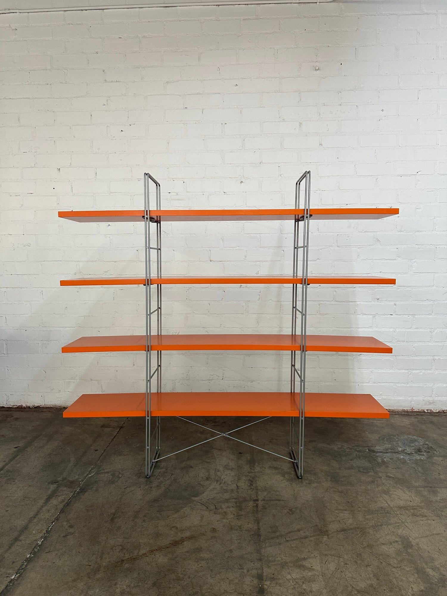 W67 H62.5 D14 Shelf Space 12.5

Rare Room divider or bookcase by Niels Gammelgaard for Ikea circa 1990s. Bookcase features rare orange laminate shelves. Shows well overall with no major wear. Item is sound with no breaks or chips visible to metal
