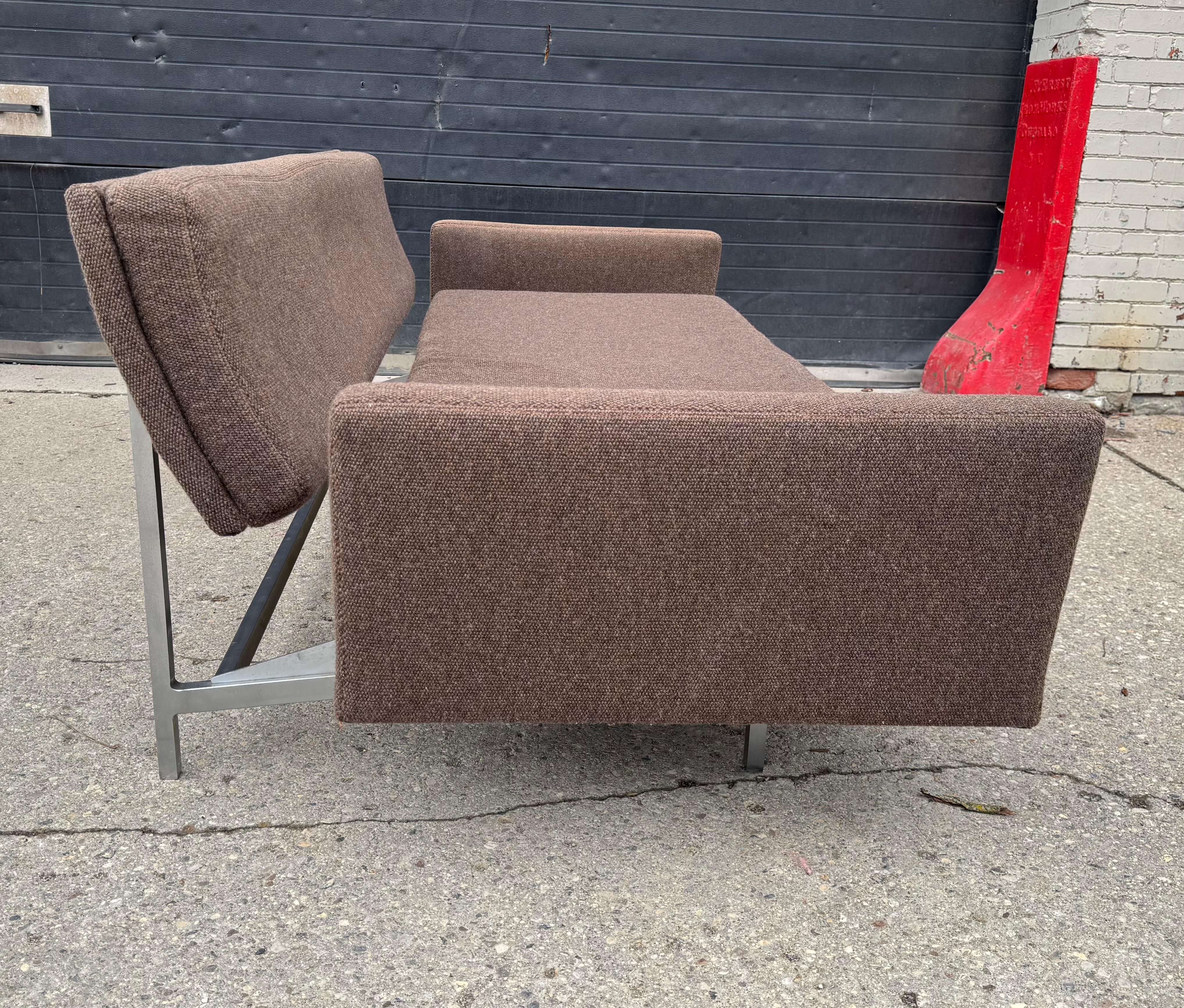 Rare Convertible sofa designed by Richard Schultz for Knoll International. MID 1950'S..Ingenious design as the seat pulls forward and up to create a flat and level bed. Wonderful and classic Mid-Century Modern design.,, Retains original Knoll fabric