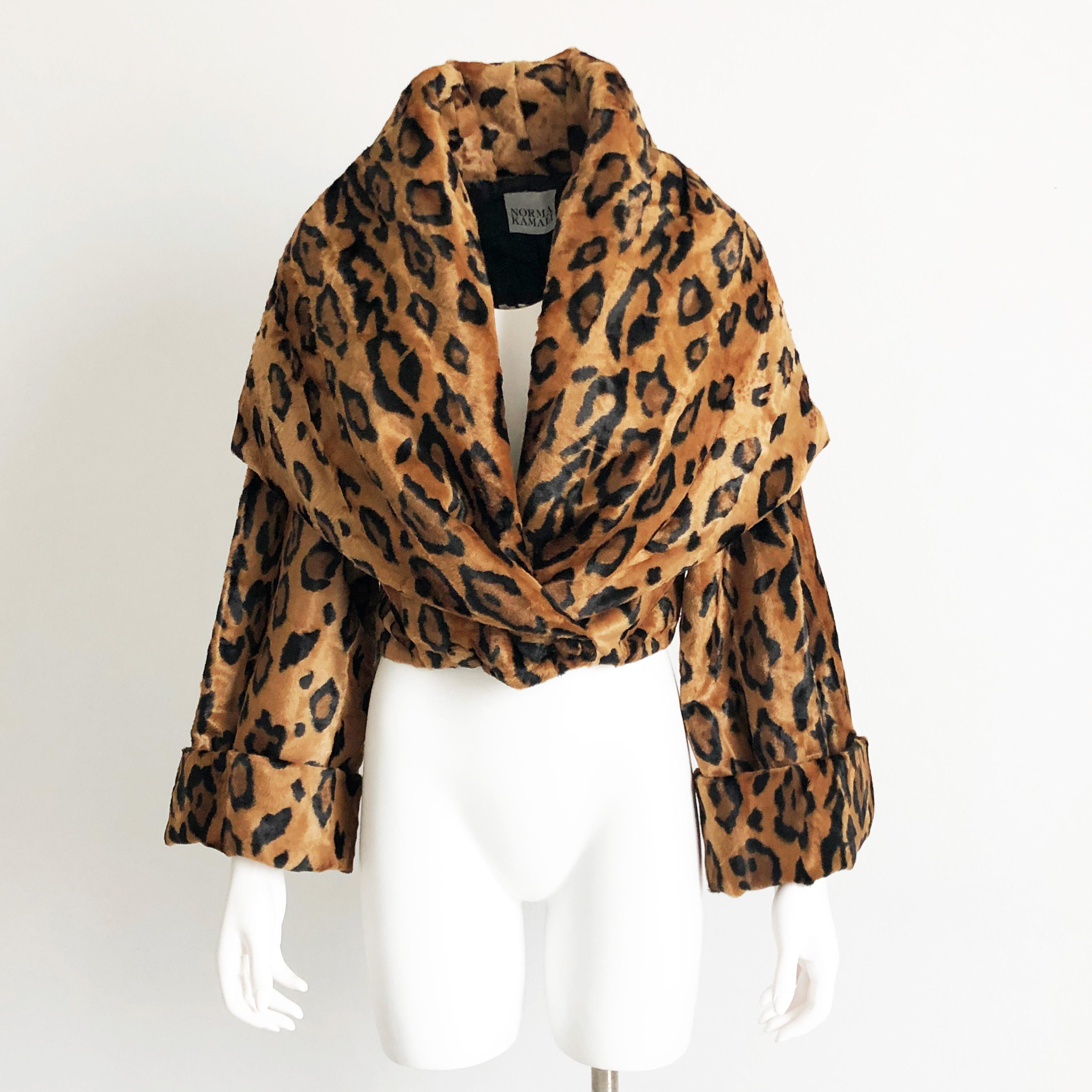 Vintage Norma Kamali Cropped Tiger Print Faux Fur Jacket with Shawl Collar, circa the 1980s. A similar piece is for sale on the designers vintage website for $7000+ (and shows it being worn by Madonna in the 80s). Huge shawl collar can be worn many