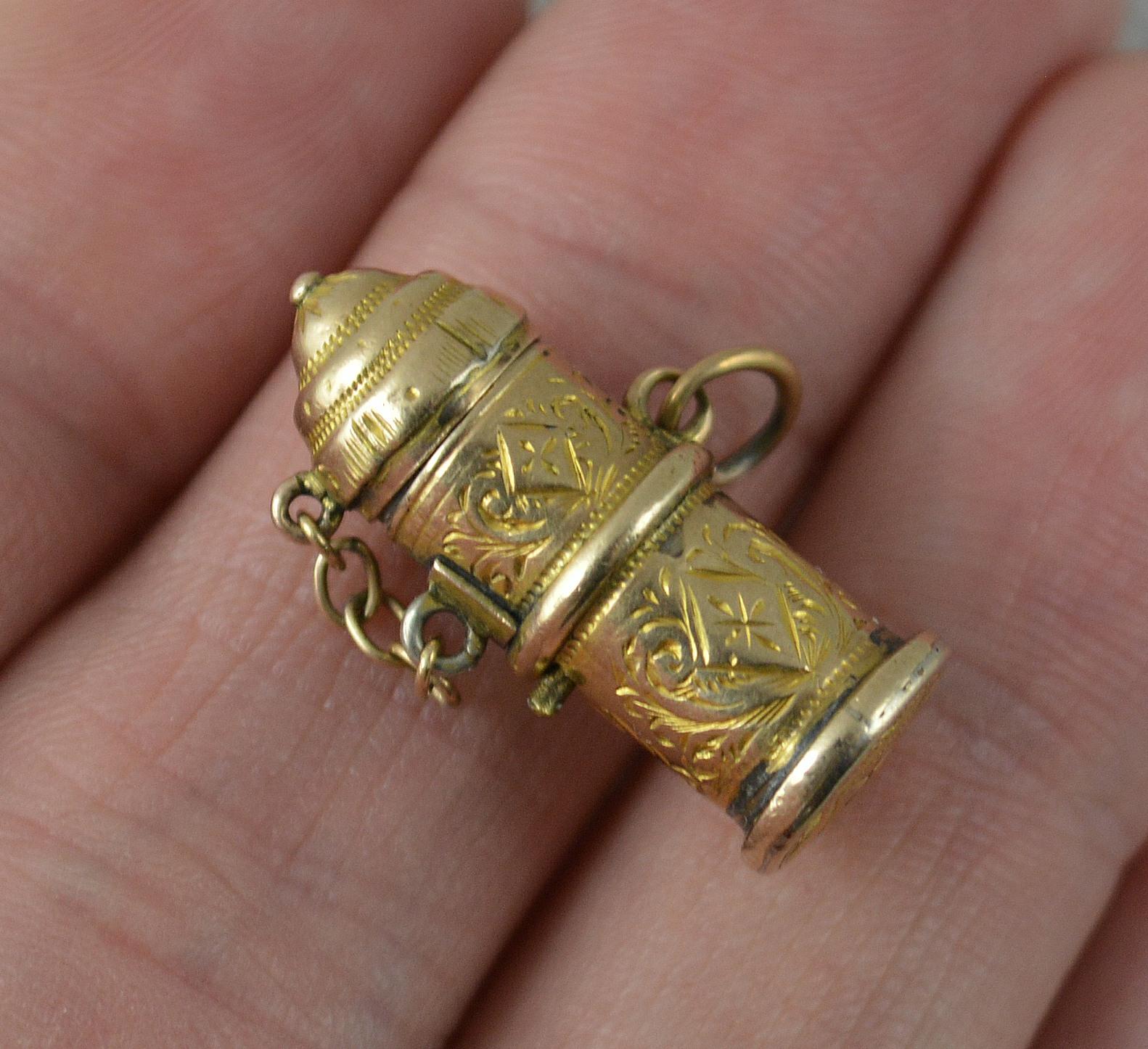 A highly unusual novelty charm pendant.
True Victorian example c1880.
Solid 9 carat yellow gold example with fine engraved design throughout.
The piece with spring insert which pops up to reveal an enamelling devil type creature.

CONDITION ; Very