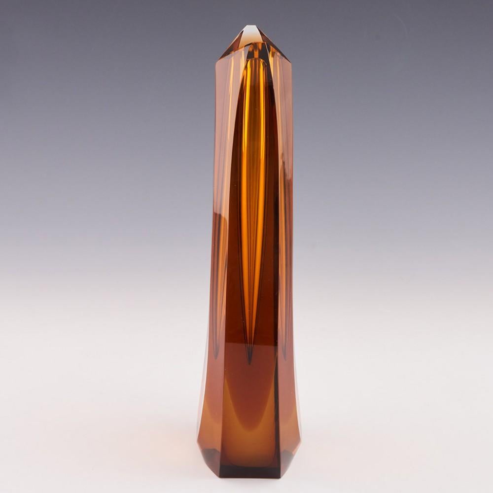 Heading : Pavel Hlava cased 'Monolith' vase
Date : Designed 1958 - this example is probably from the 1960s
Origin : Novy Bor
Bowl Features : Colouless and amber glass with slice cutting
Type : Lead
Size : 23.7cm height, 9cm width
Condition