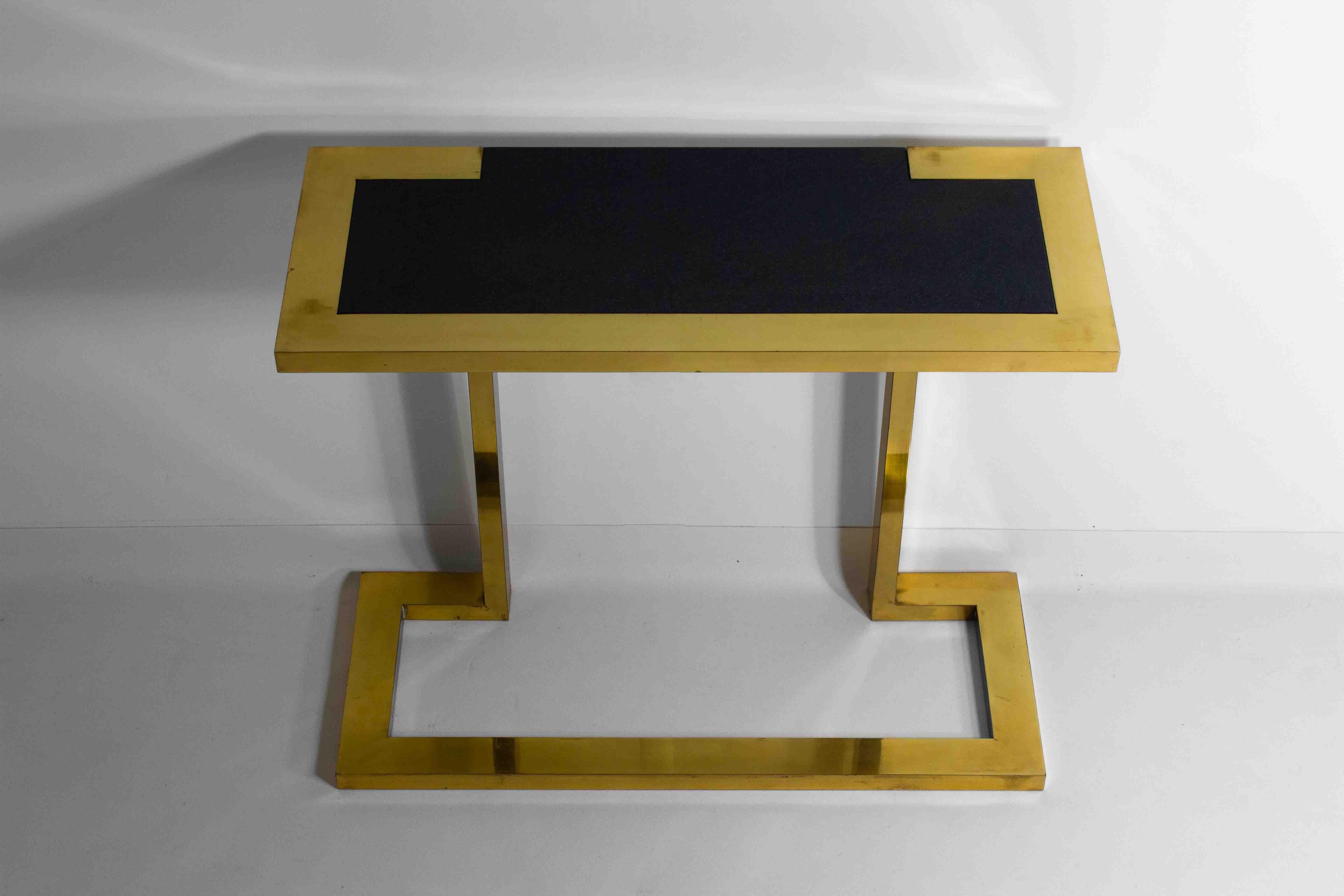 This extremely rare freestanding console by Nucci Valsecchi, with its bronze frame and blue granite inlay, is a refined example of the designer’s expertise in the haute-gamme of regency furniture design. The artist’s use of bronze, often favored for