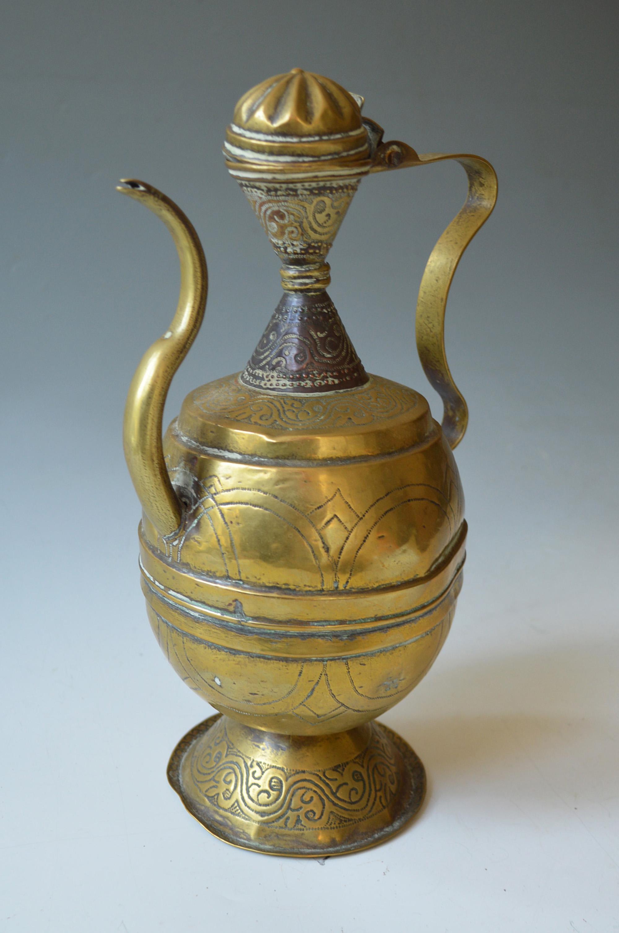 A Elegant brass Ewer from the Nupe people of Nigeria,

Hand raised and worked from beaten sheet brass and copper

The Nupe people are very skilled metal workers and wood carvers and renowned for art

Period 19 th century

Measures: Height 34