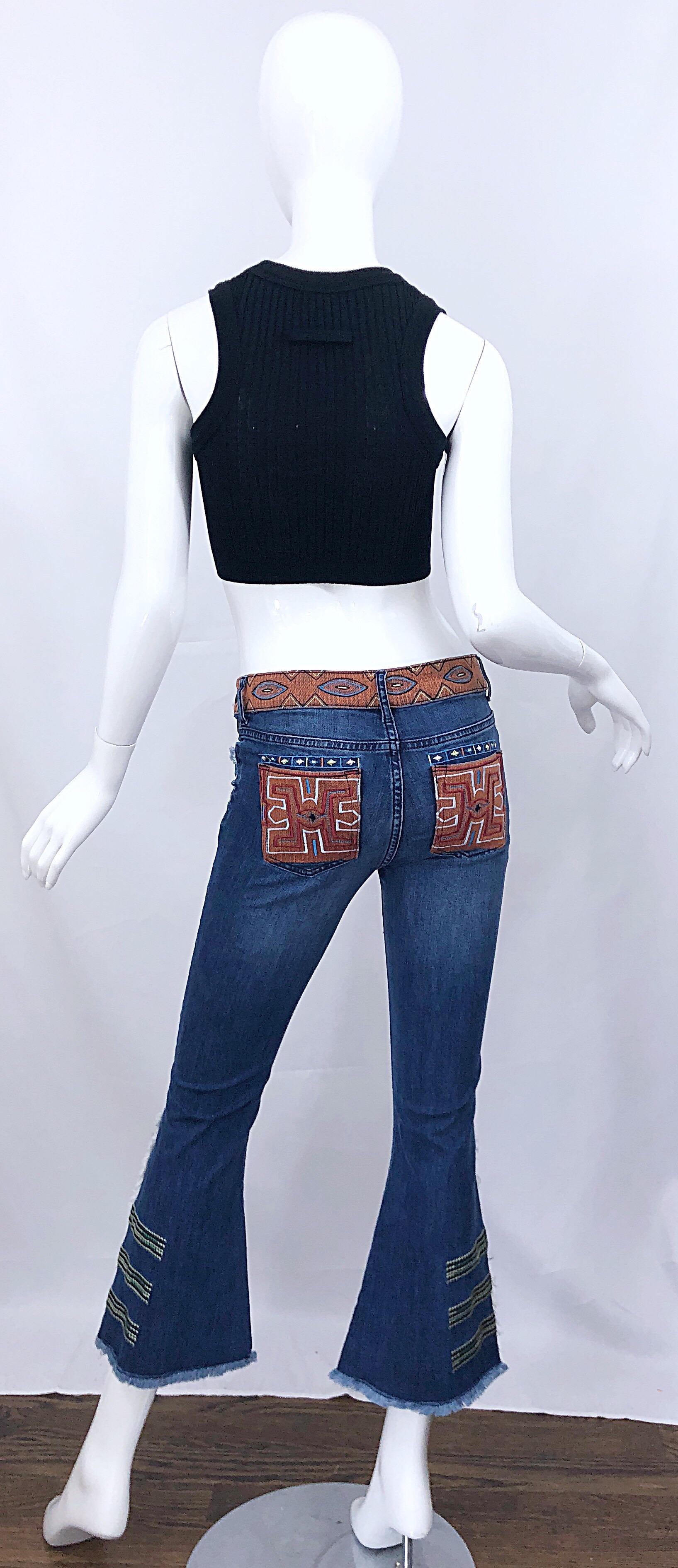 Rare brand new with tags early 2000s vintage NICOLE MILLER ARTELIER low rise cropped flare leg raw edge denim culottes / blue jeans. Features intricate embroidery throughout in warm colors of orange, red, burnt orange, green, blue, purple, pink,