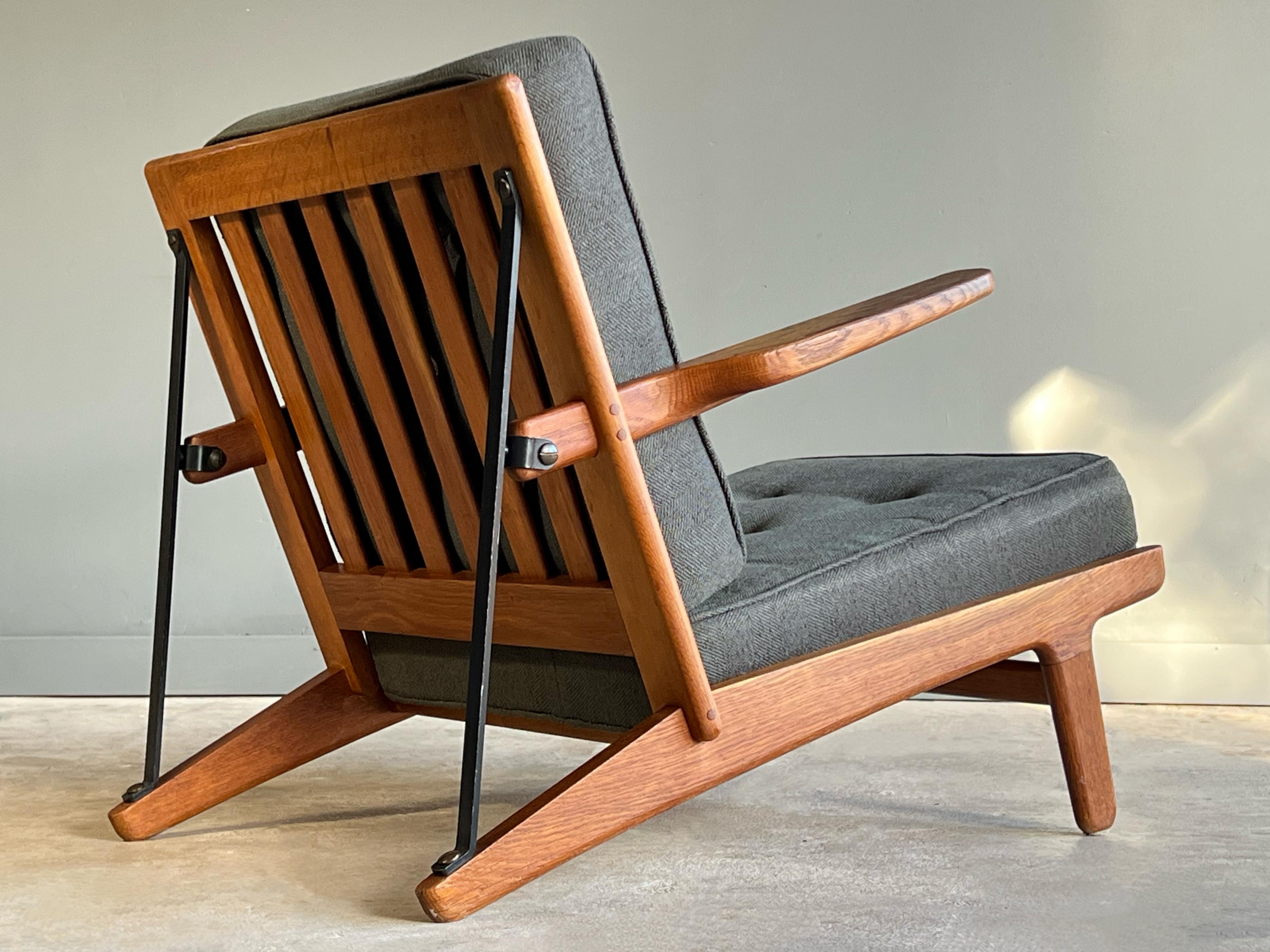 Very rare and early ‘easy chair’ designed by Børge Mogensen and produced by Andreas Graversen/Fredericia Furniture. 

Executed in quarter sawn oak, iron, brass and original wool cushions. Model 240-11 was designed in 1954 and is almost never