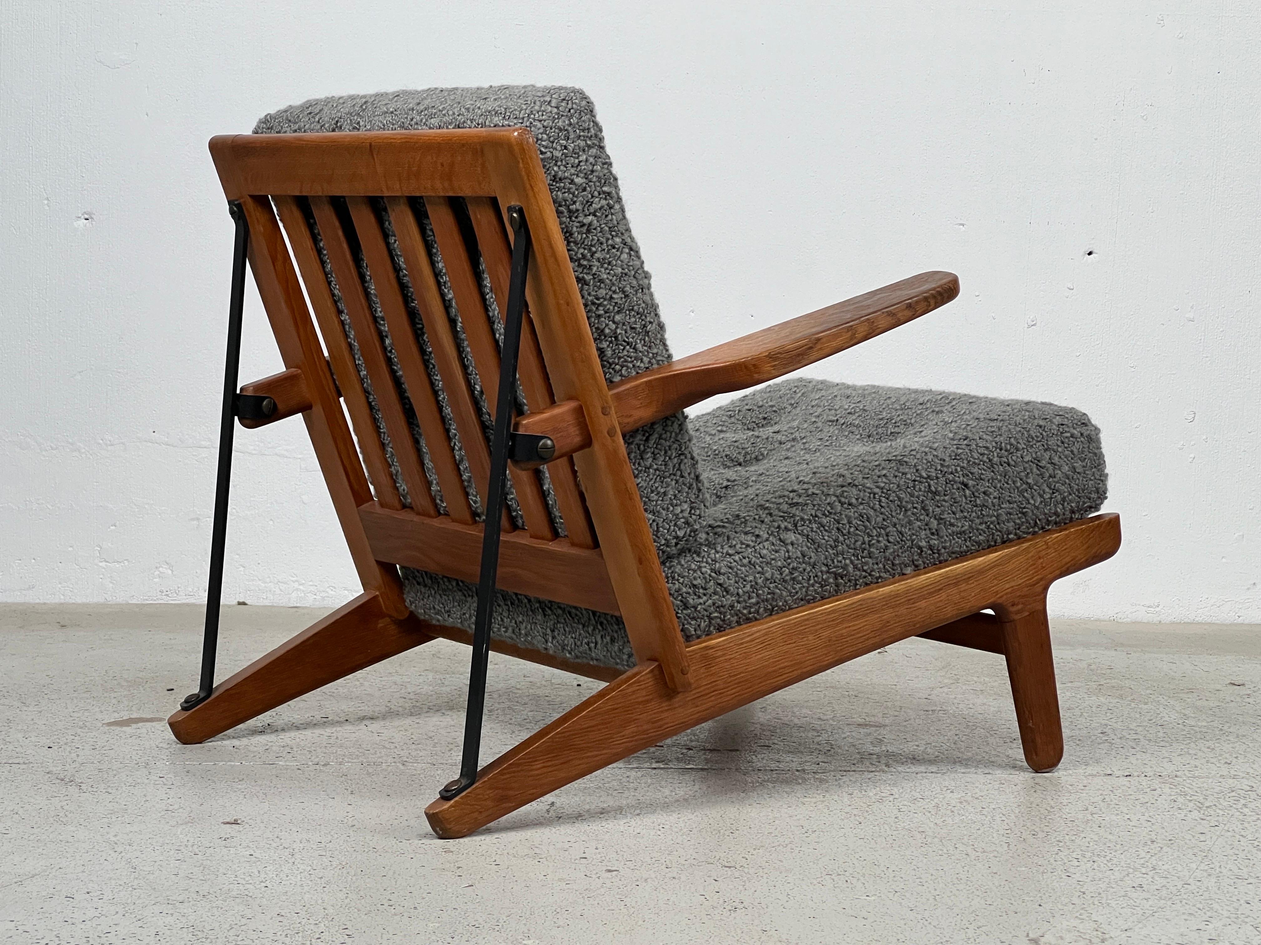 Very rare and early model 240-11 ‘easy chair’ designed by Børge Mogensen and produced by Andreas Graversen/Fredericia Furniture.  Executed in quarter sawn oak, iron, brass and upholstery.  