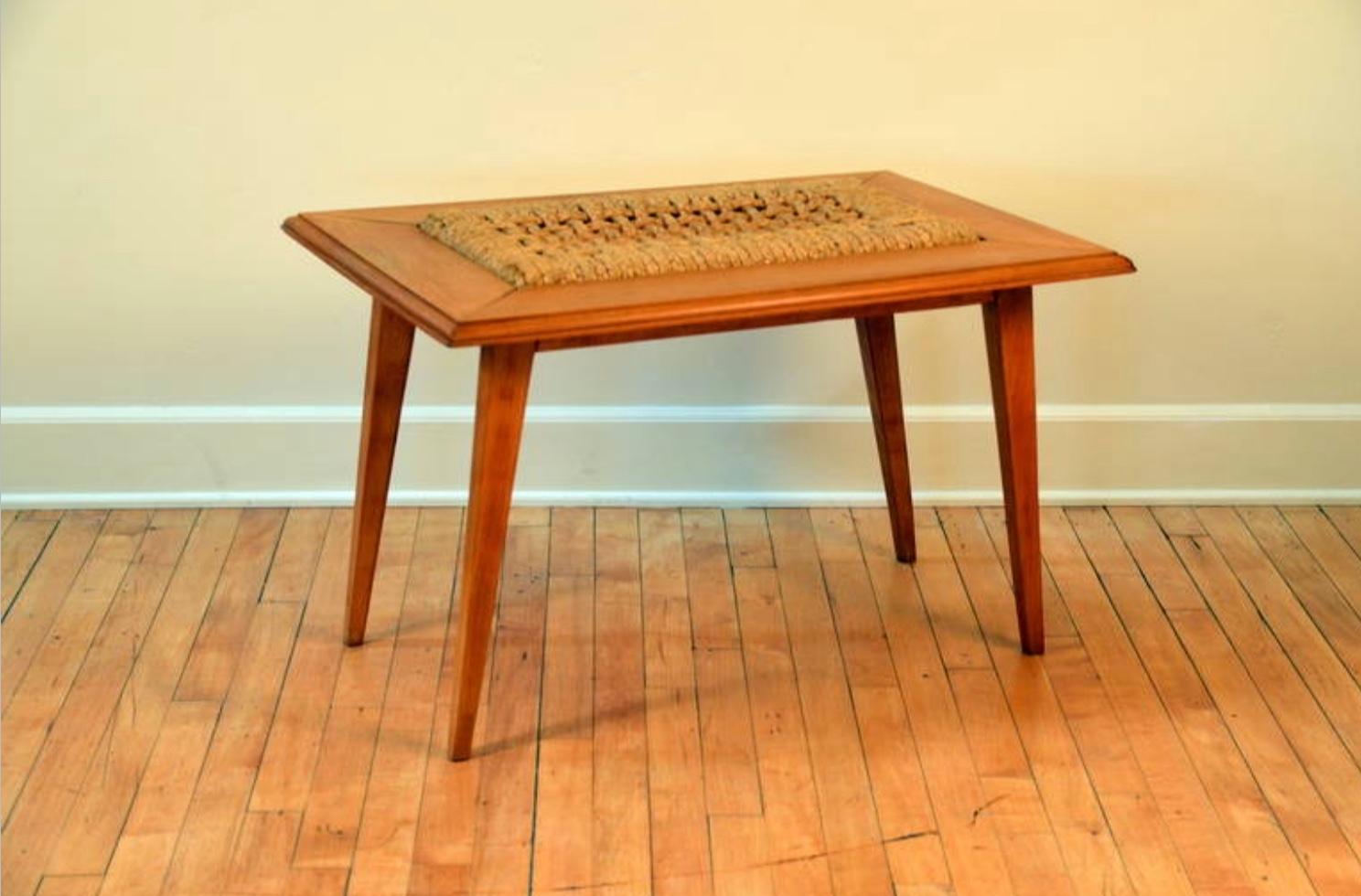 Rare oak and rope side table by Adrien Audoux and Frida Minet. Great texture from the combination of the rough rope center and the polished oak frame.