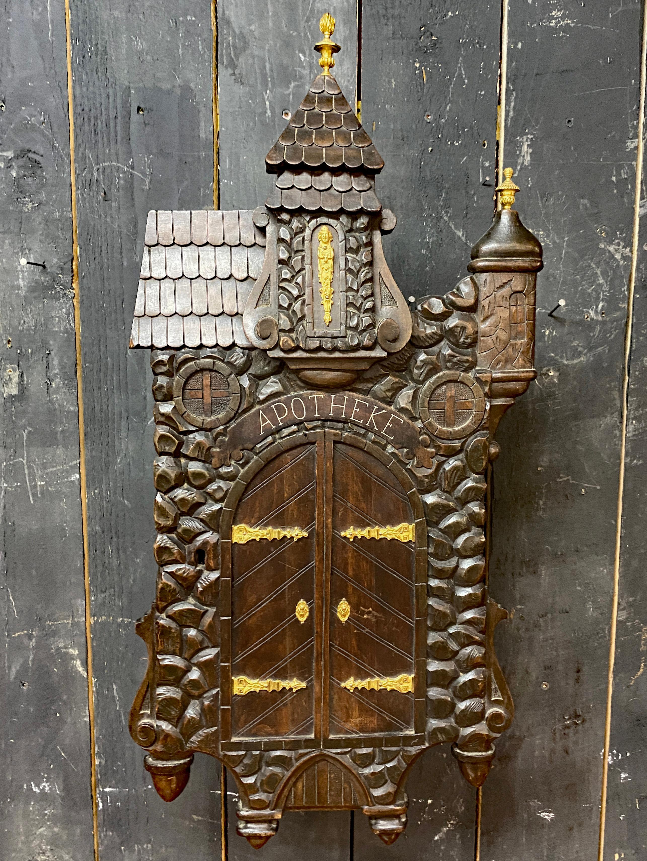 Rare old 19th century pharmacy, black forest, in carved wood, brass and bronze decoration, with 