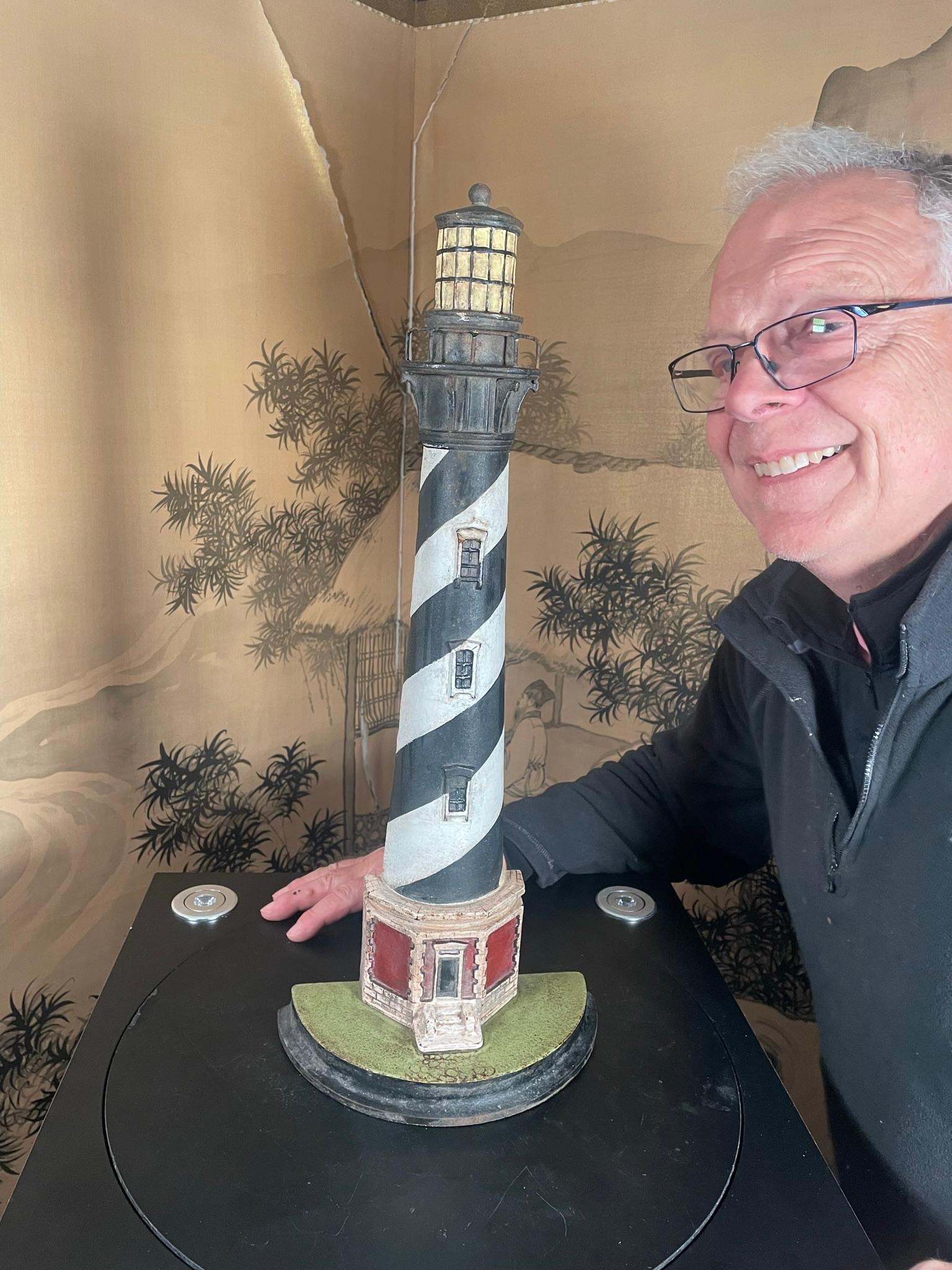 A hard to find tall 21 inch Nautical delight with original hand painted colors that authentically reproduces the actual colors and handsome physical architecture of today's Cape Hattaras light house (See Third Photo).

First we've seen in this