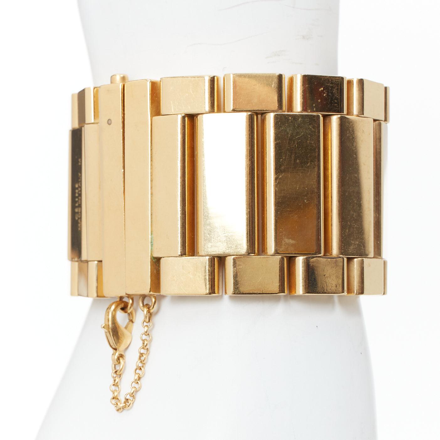 rare OLD CELINE Phoebe Philo Manchette gold tone watch link wide bracelet
Reference: TGAS/E00720
Brand: Celine
Designer: Phoebe Philo
Material: Metal
Color: Gold
Pattern: Solid
Closure: Clasp
Made in: Italy

CONDITION:
Condition: Very good, this