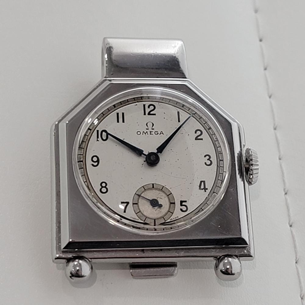 Extremely rare Omega Pocket or Money Clip watch, manual wind, circa 1930s. A vintage collectable classic. Verified authentic by a master watchmaker. Gorgeous Omega signed silver dial, Roman numeral hour markers, outer minute markers, central minute
