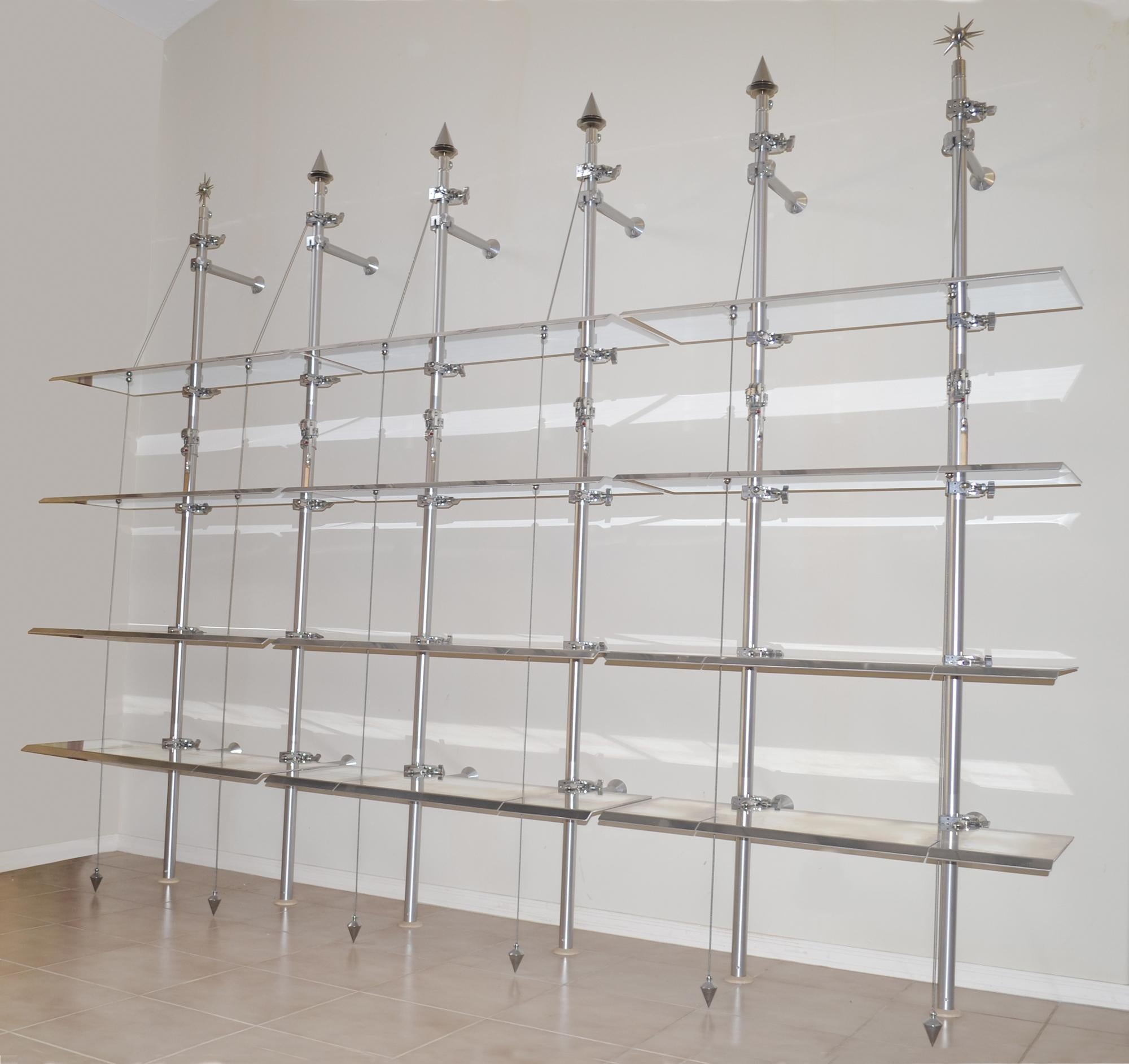 Rare 1980s ALU Manfrotto Modular Bookcase Shelf System Wall Unit or Display

An amazing one-off 1980s modular shelf system / wall unit / retail display, by ALU, Italy, consisting of six poles and twelve shelves constructed of precision machined