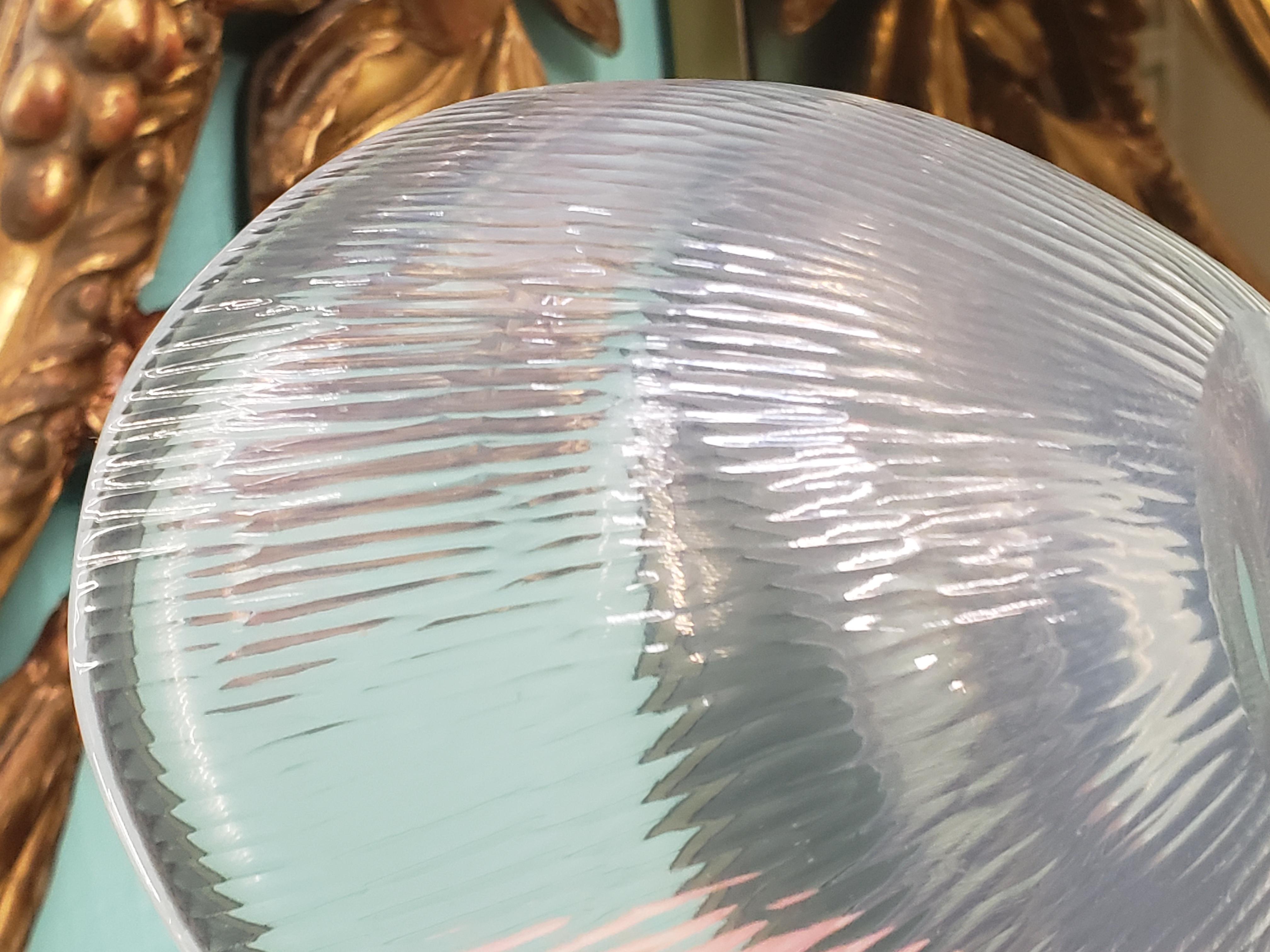 I've never seen one of these before, it's a chiselled glass
or battuto bowl in opalescent glass in a shape commonly referred to as a Selena bowl but it must've been pretty rare as this is the only one in this style I can find. The bowl was designed