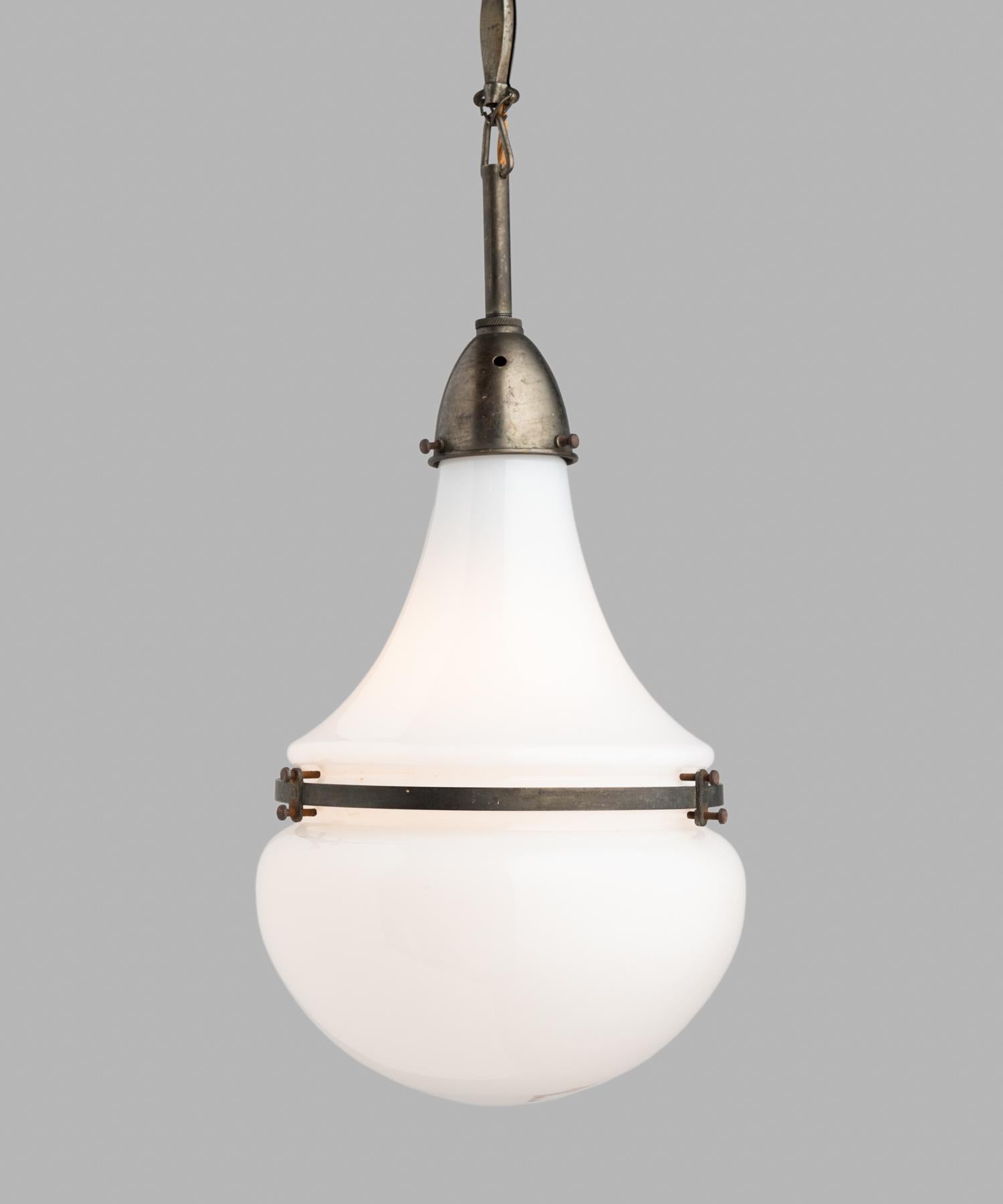 Rare opaline and glass pendant by Peter Behrens, Germany, circa 1910.

Small pendant with opaline glass, secured with copper fitter and brace. Designed by architect Peter Behrens and produced by Siemens for AEG.

Measures: 9