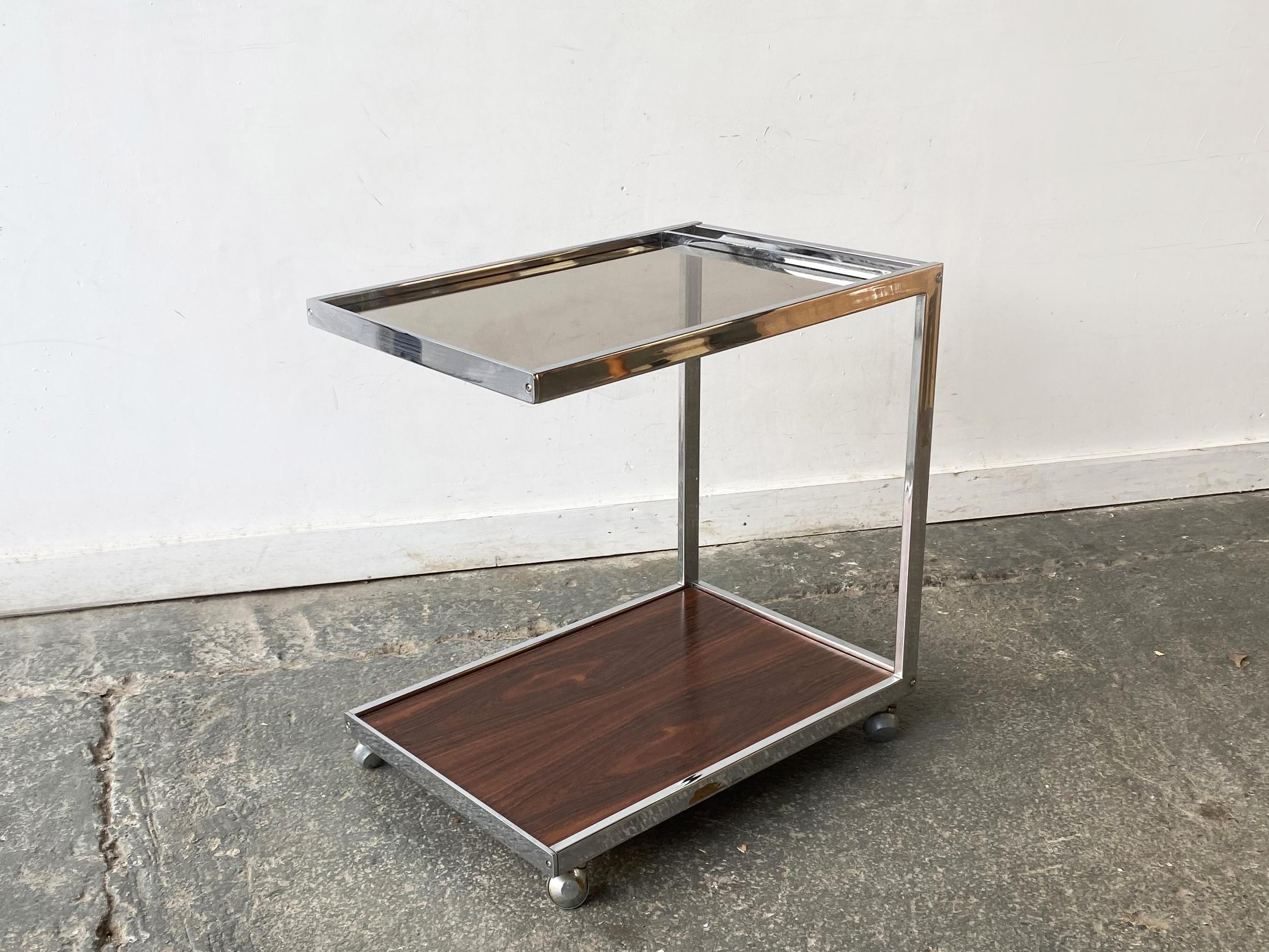Made by British Manufacturer MDA (Miller Design Associates) and designed by Howard Miller. MDA produced designs in a similar style as an other well respected design company; Merrow Associates.

Very unusual to find an ‘open ended’ drinks trolley by