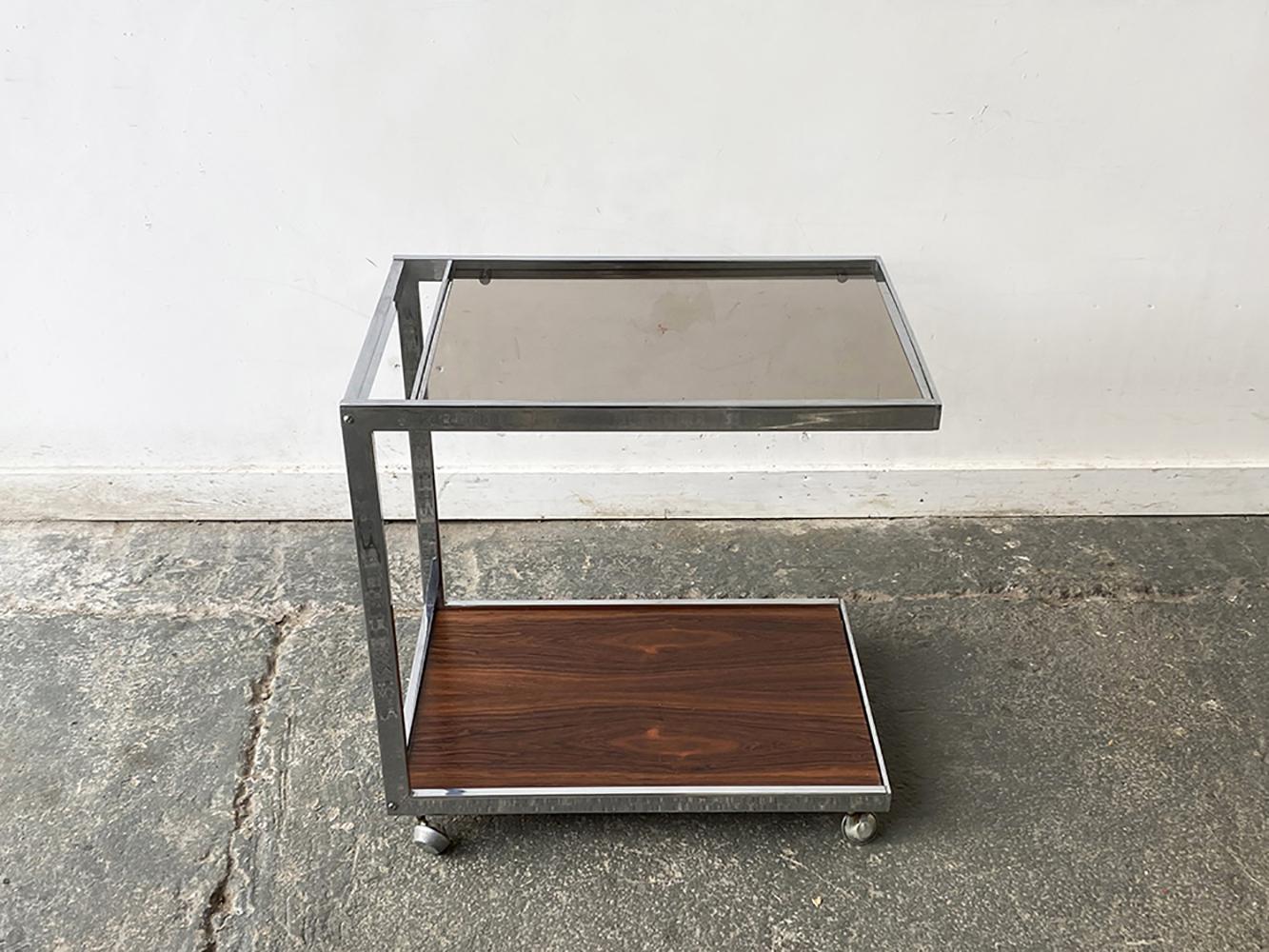 Made by British Manufacturer MDA (Miller Design Associates) and designed by Howard Miller. MDA produced designs in a similar style as an other well respected design company; Merrow Associates. 

It is very unusual to find an ‘open ended’ drinks