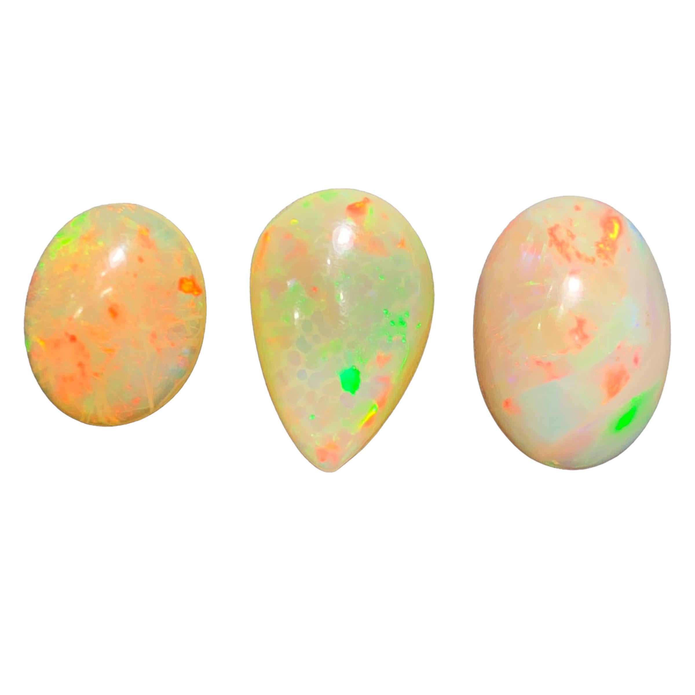 GEMSTONE TYPE: Opal
PIECE(S): 3
WEIGHT: 20 Carats
SHAPE: Oval and Pear Shape Cabochons
SIZE (MM): 
4.20 Ct: 15.06 x 12.14 x 5.93
7.70 Ct: 19.13 x 12.56 x 5.97
8.10 Ct: 18.47 x 13.01 x 7.16
COLOR: Orange Half White
CLARITY: Opaque Play of