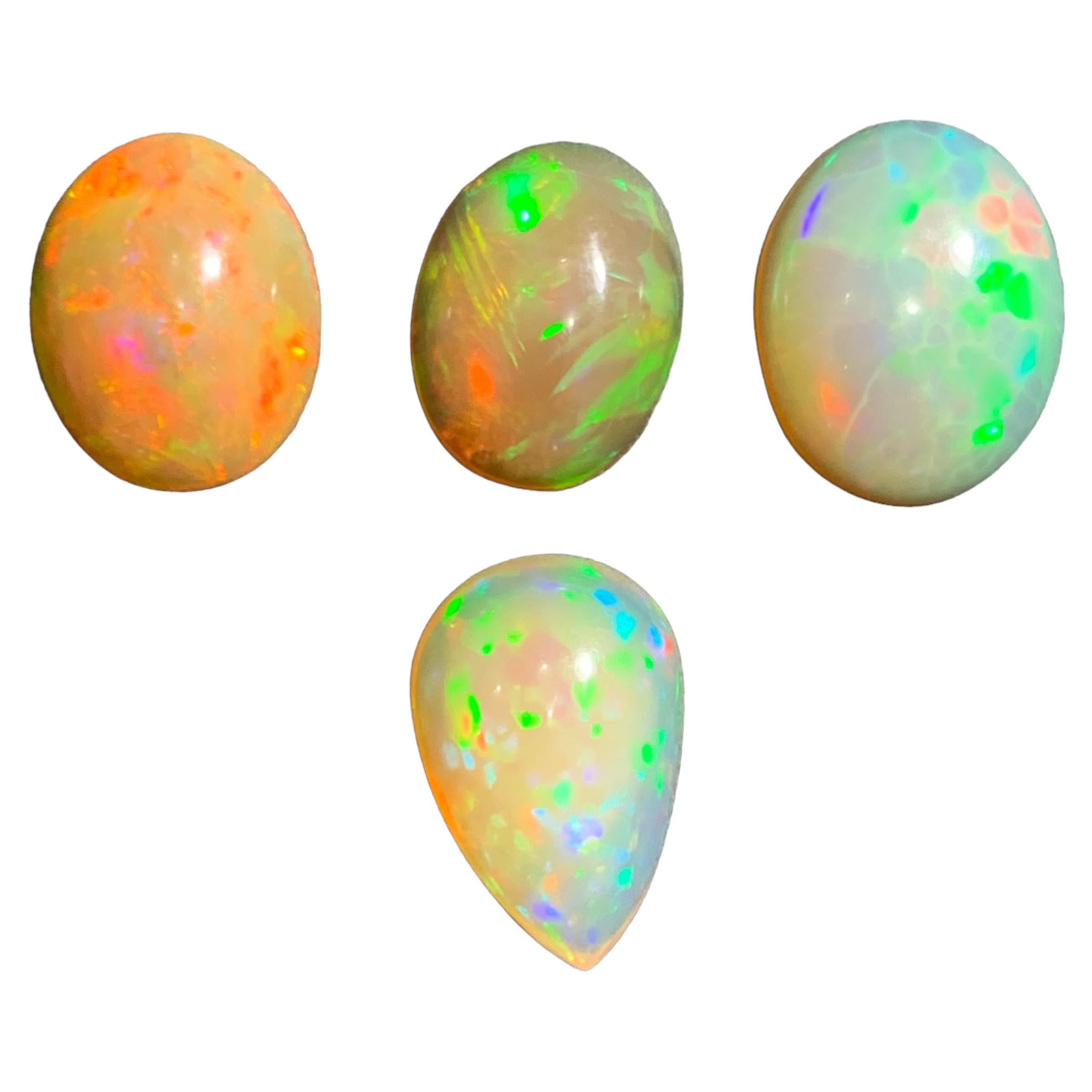 GEMSTONE TYPE: Opal
PIECE(S): 4
WEIGHT: 15 Carats
SHAPE: Oval and Pear Shape Cabochons
SIZE (MM): 
3.25 Ct: 12.34 x 9.90 x 5.80
3.00 Ct: 12.41 x 9.49 x 5.20
4.10 Ct: 13.68 x 10.98 x 5.46
4.65 Ct: 14.29 x 9.44 x 7.25
COLOR: Orange Play of