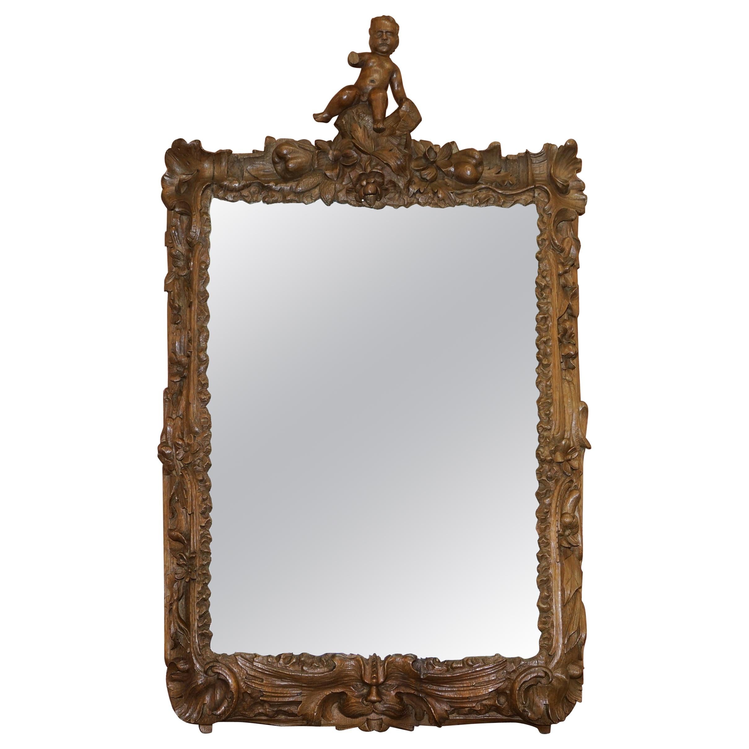 Rare Original 18th Century Ornately Carved Frame Wall Mirror with Cherub Boy For Sale