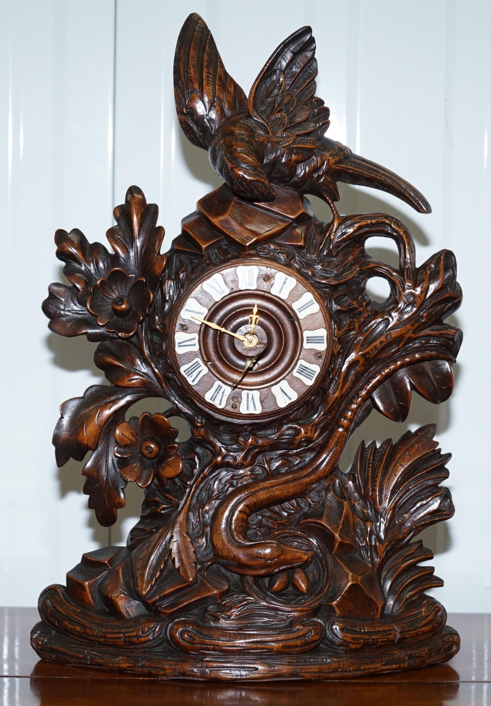 We are delighted to offer for salethis lovely original late 19th century Black Forest Linden wood clock garniture set with original candles

Its very rare to find sets with the candlestick holders still present, it’s even rarer for those