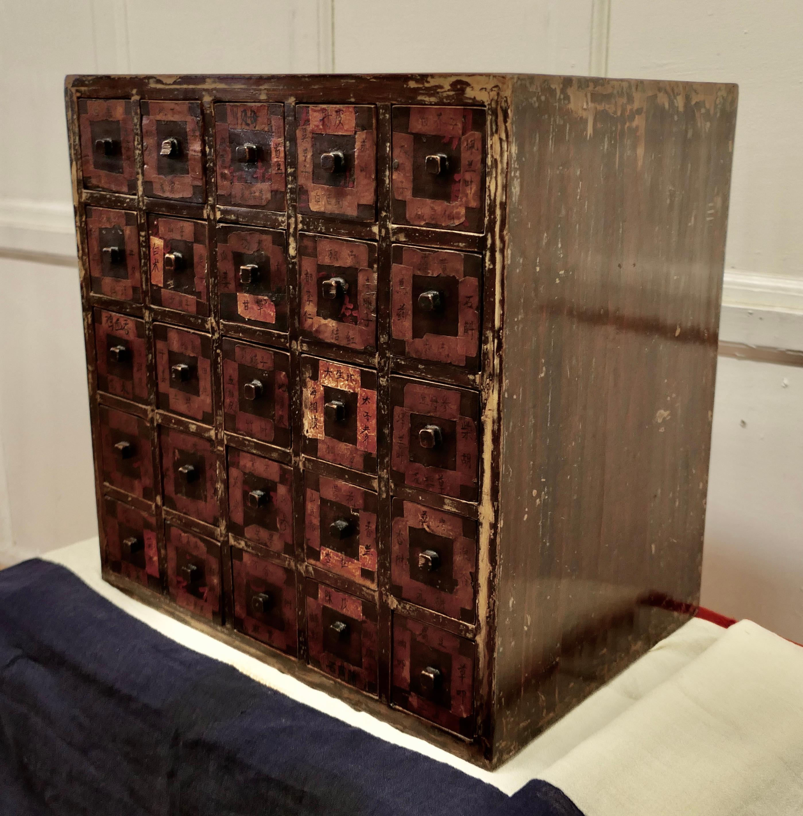 Rare Original Chinese Herbal Apothecary’s 25 drawer chest.

This is a Chinese Apothecary Cabinet it was once used by a Herbal Physician to keep the herbs and remedies used in Chinese Medicine 
The front of each drawer has very detailed medicine