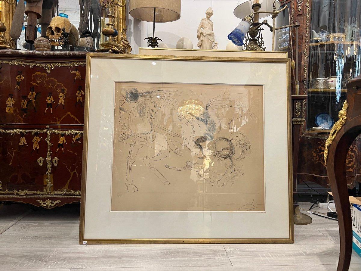 An original etching on Vellum numbered and signed by Salvador Dali by pencil in the margin.  The drawing depicts a combat scene where a knight on horseback is engaged in a duel with the undefeated steed of another knight who met his demise in the