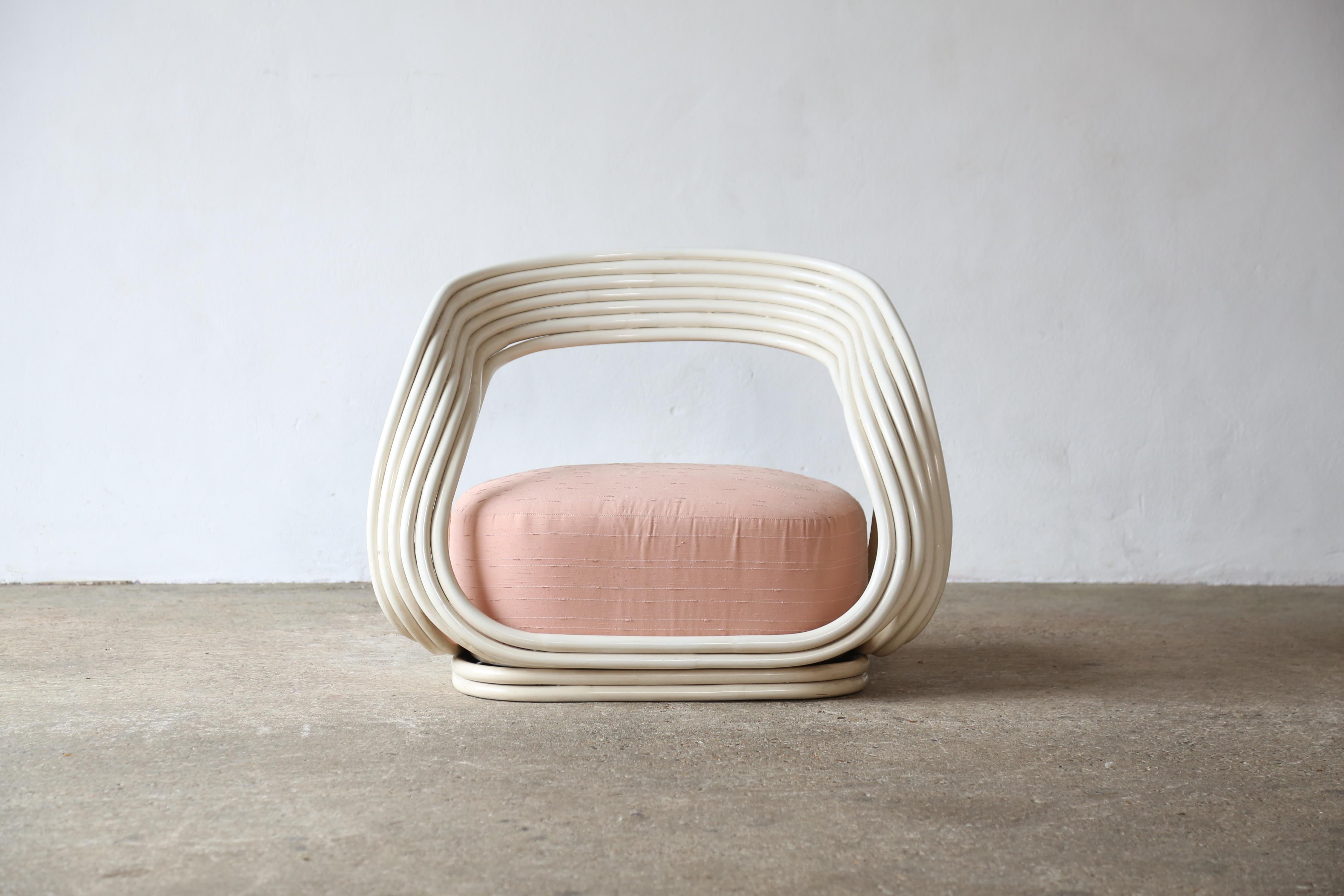 A rare, original 1960s Eva Chair designed by Giovanni Travasa in 1965, and produced by Bonacina, Italy.   This example from a now closed independent boutique in Torino in rare white bamboo with pleasing original seat fabric.  In good original