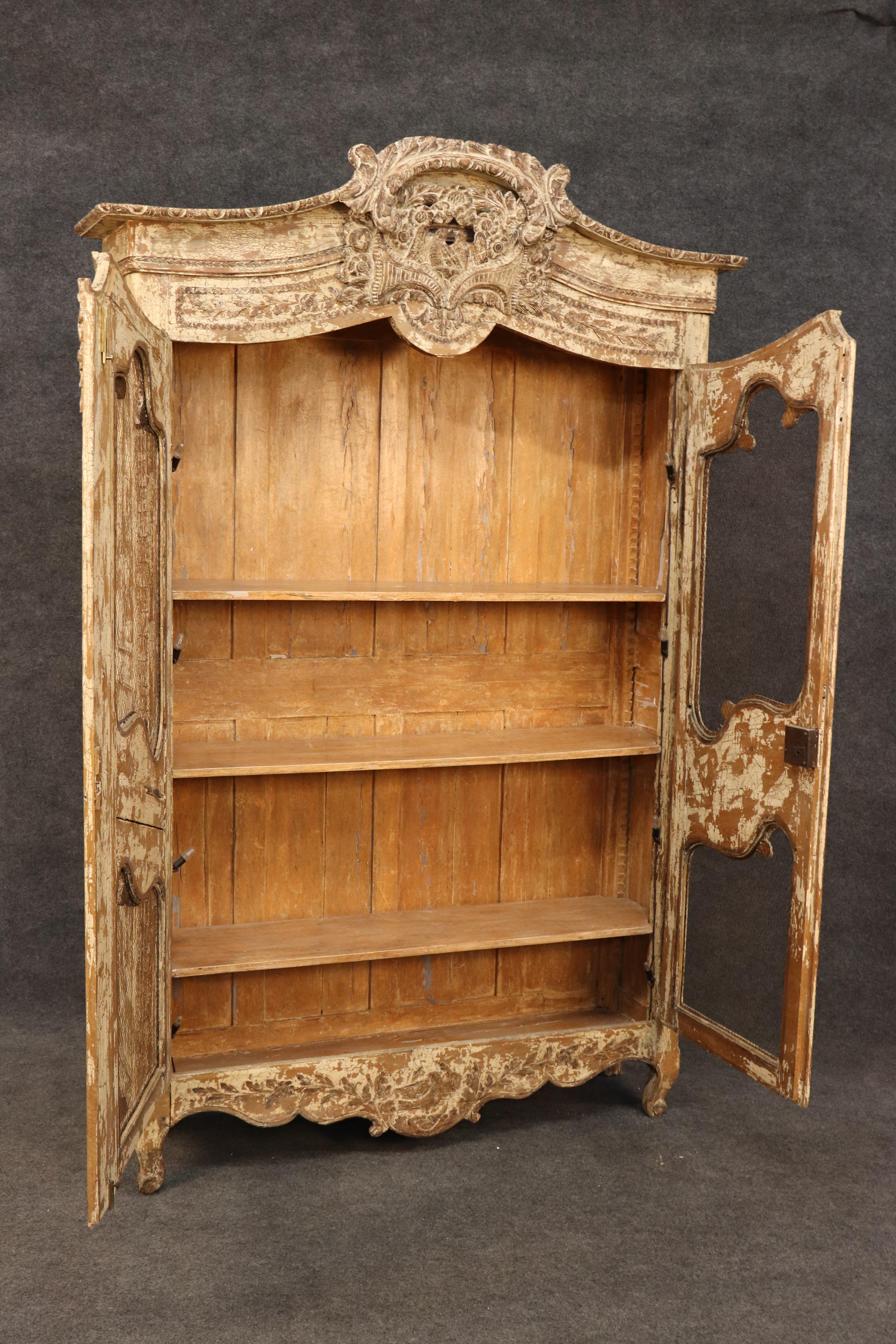 This is a superb, ENTIRELY ORIGINAL Milk-painted distressed finish (time-worn) with no damage or issues beyond 200 years of age and patina. Look at the incredible chippy creamy white paint and notice that its open with mesh grillwork in the doors.