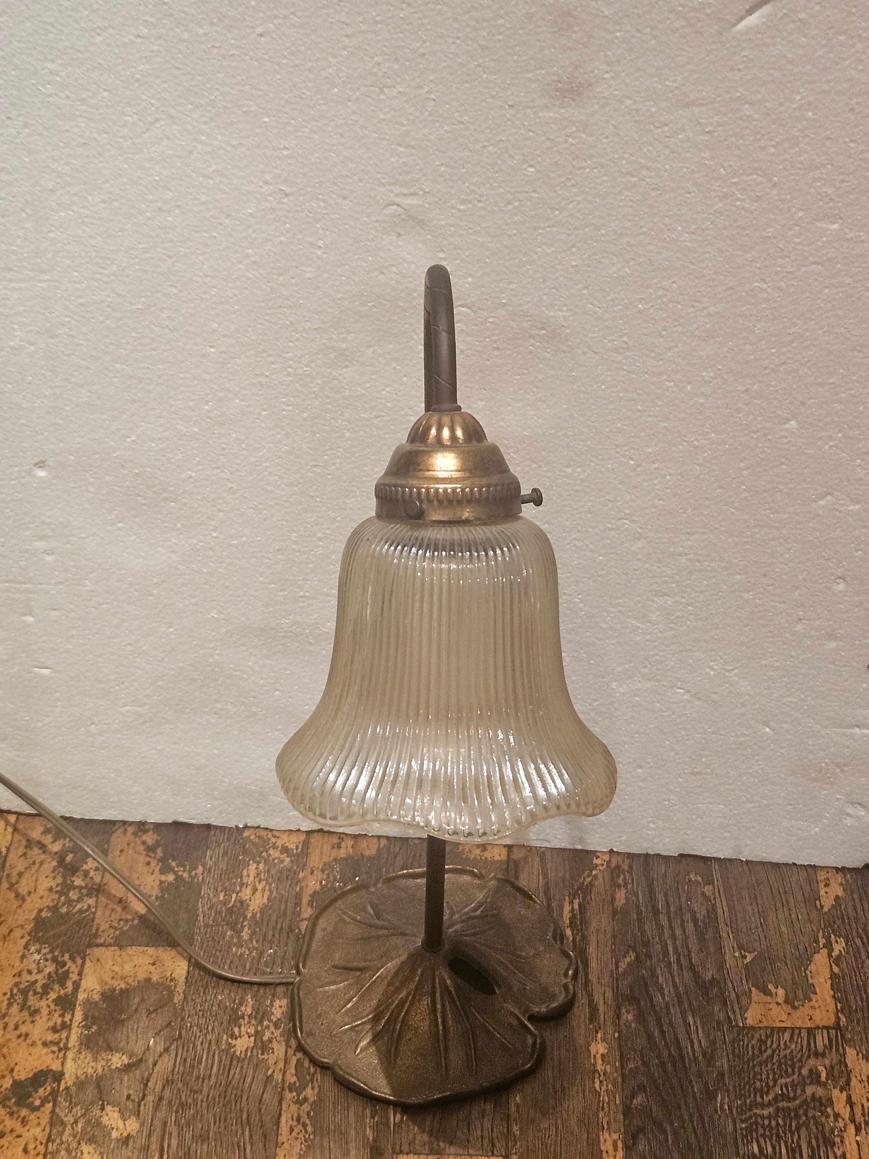 The Following Item we are offering is this Beautiful Rare art glass table Lily lamp, featuring a baluster form shade with a water lily petal design base. Taken out of an Important New York City Estate.

Dimensions:  17