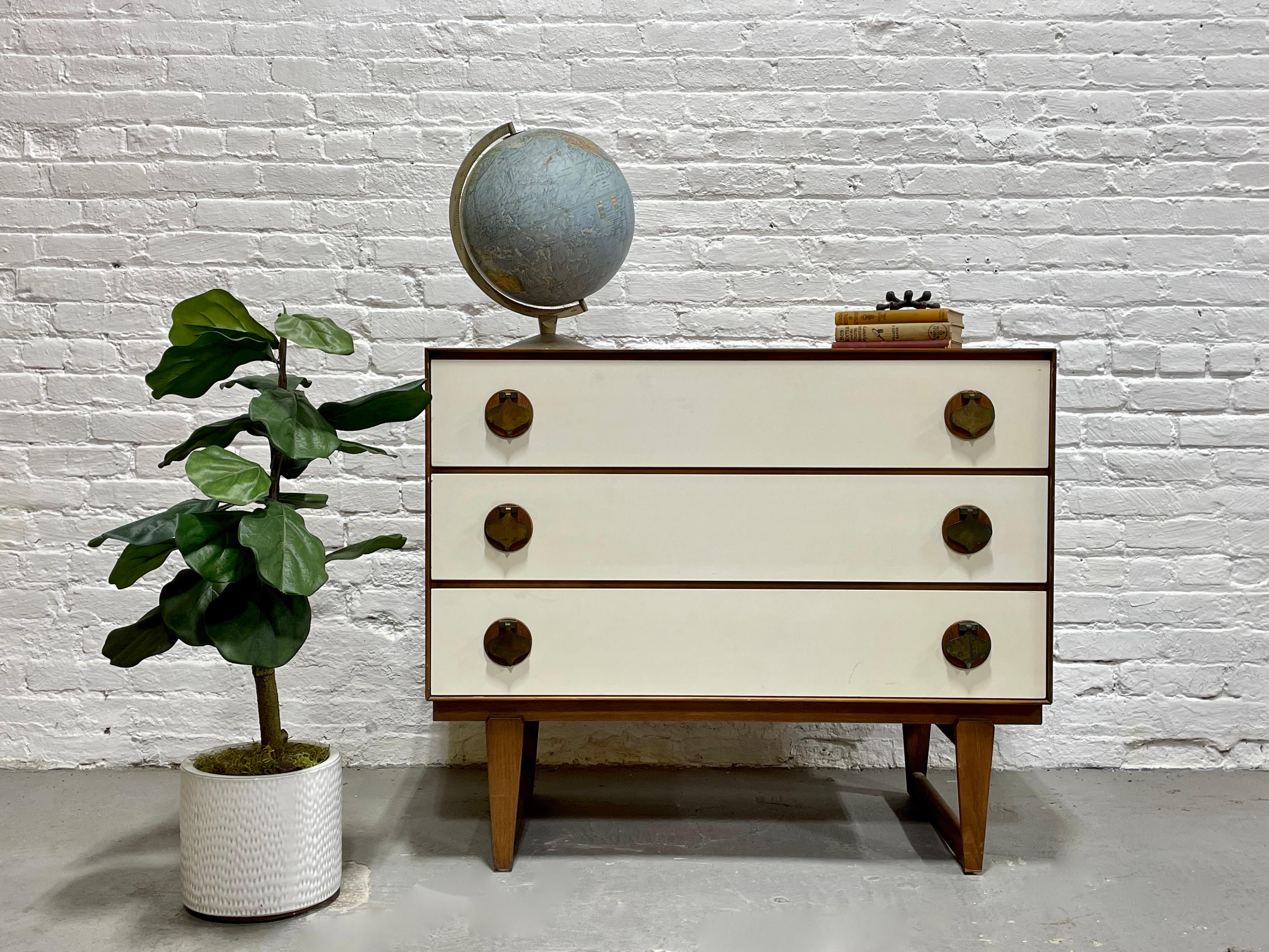 Rare + Original Mid Century Modern White & Walnut Dresser by Stanley Furniture Co., c. 1960's. This elusive series was in limited production and is incredibly hard to find. The dresser is highlighted by solid brass spade pulls over solid walnut