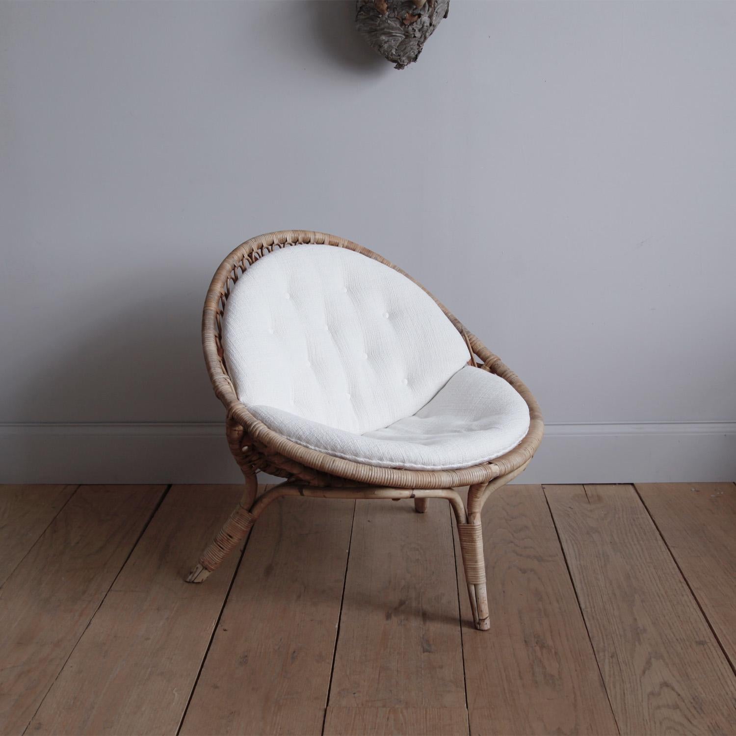 A rare original example of one of Nanna Ditzel’s wonderful rattan designs for R. Wengler of Copenhagen. Often called the First Lady of Danish Design, Ditzel cared deeply about quality and comfort, but her designs transcend purely practical