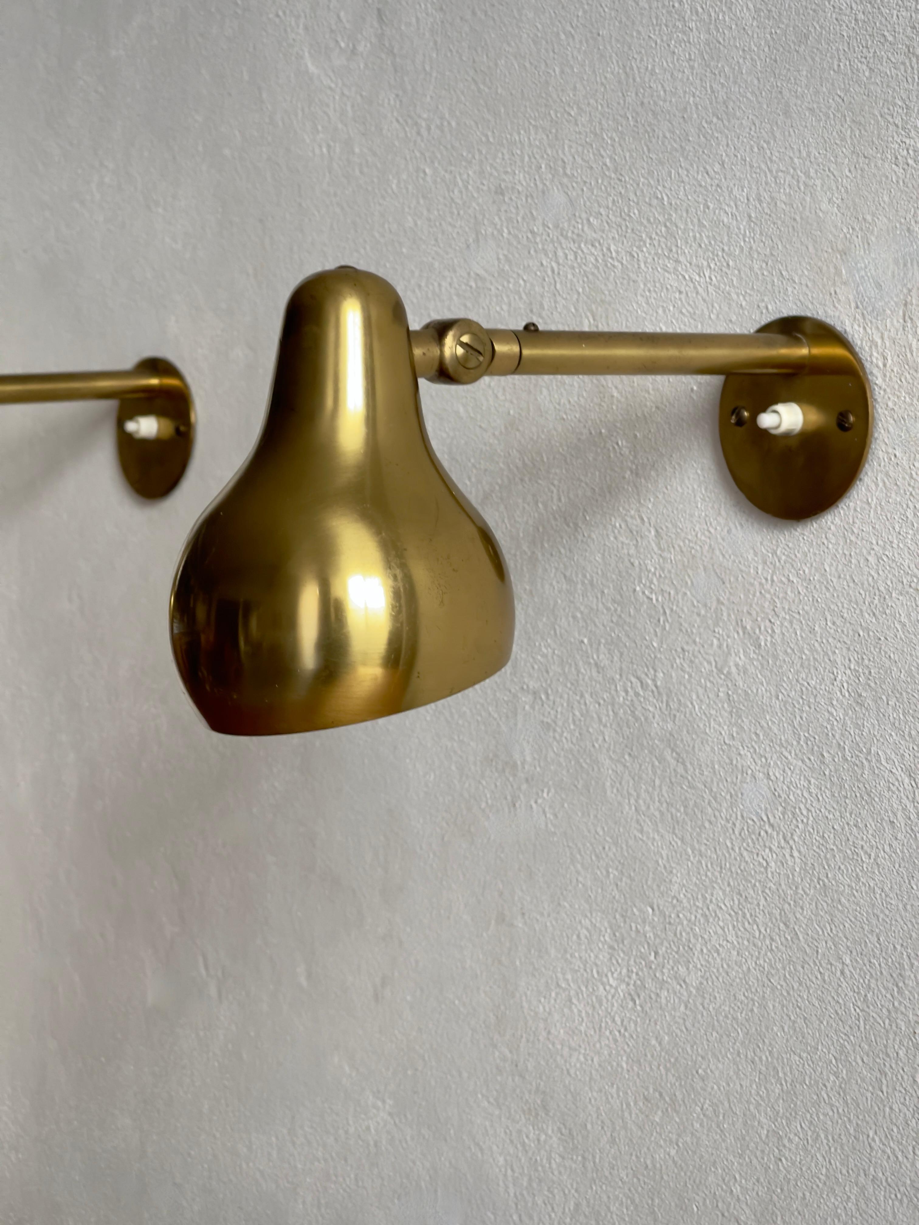 Mid-20th Century Rare Original Pair of 1940s Wilhelm Lauritzen wall lights in patinated brass. For Sale