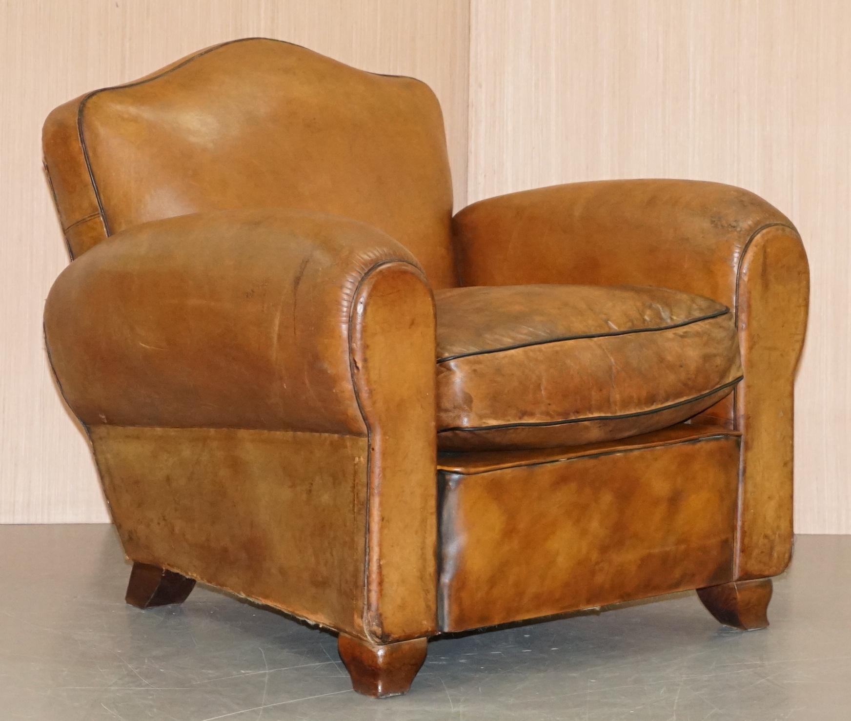 We are delighted to offer for sale this stunning pair of partially restored French circa 1890 brown leather club armchairs

An iconic pair, very stylish and almost totally original, the leather hide is the period upholstery which is rare for these
