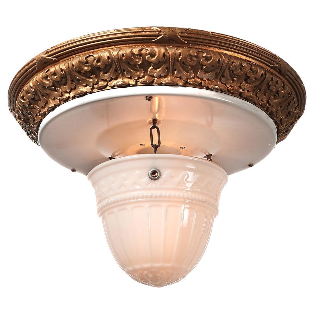 Reflectolyte flush mount fixtures have always been popular because of their unique look. The glass dome has a fluted pattern that simply hangs from 3 hooks making it easy to clean and change bulbs.. The ceiling crown is white porcelain over steel
