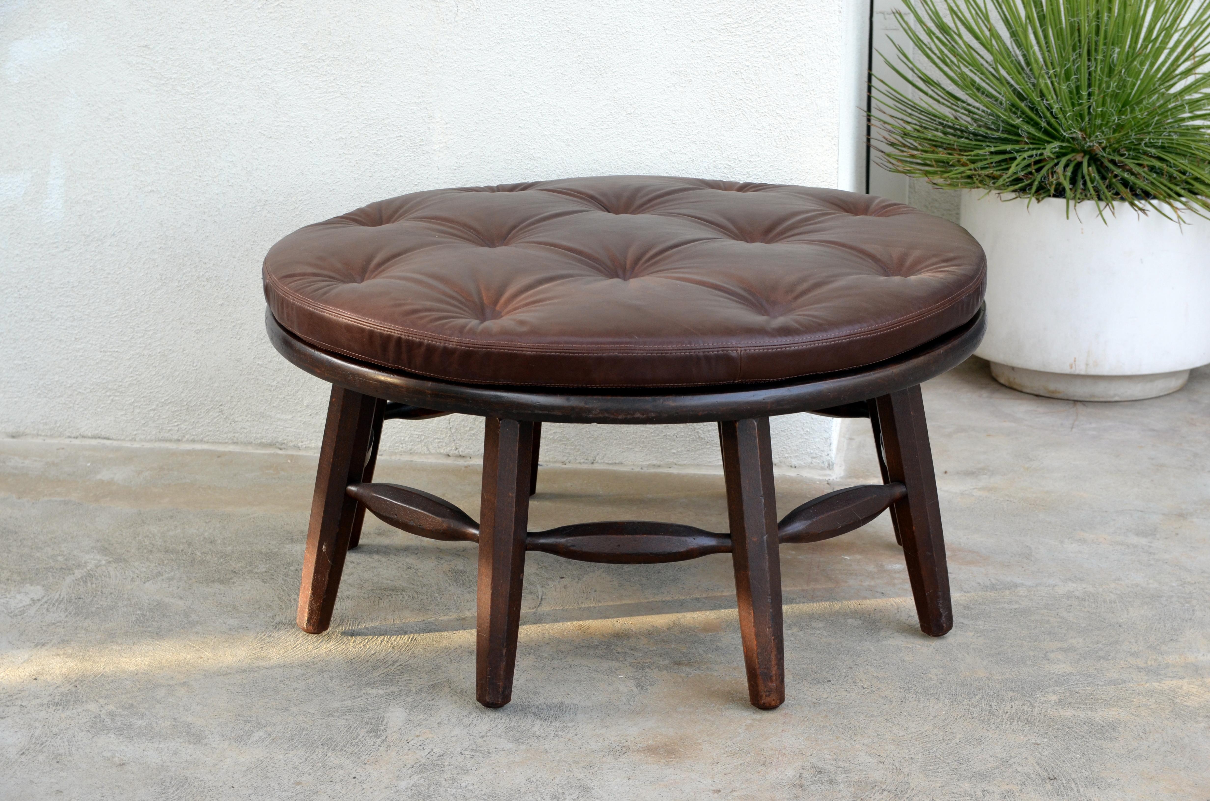 Rare original round Monterey coffee table or ottoman. Branded MONTEREY under the top.

A removable custom leather cushion is included to use this coffee table as an ottoman.

Measures: 17.5 in. tall / 20 in. tall with the cushion.
H2 17.5.