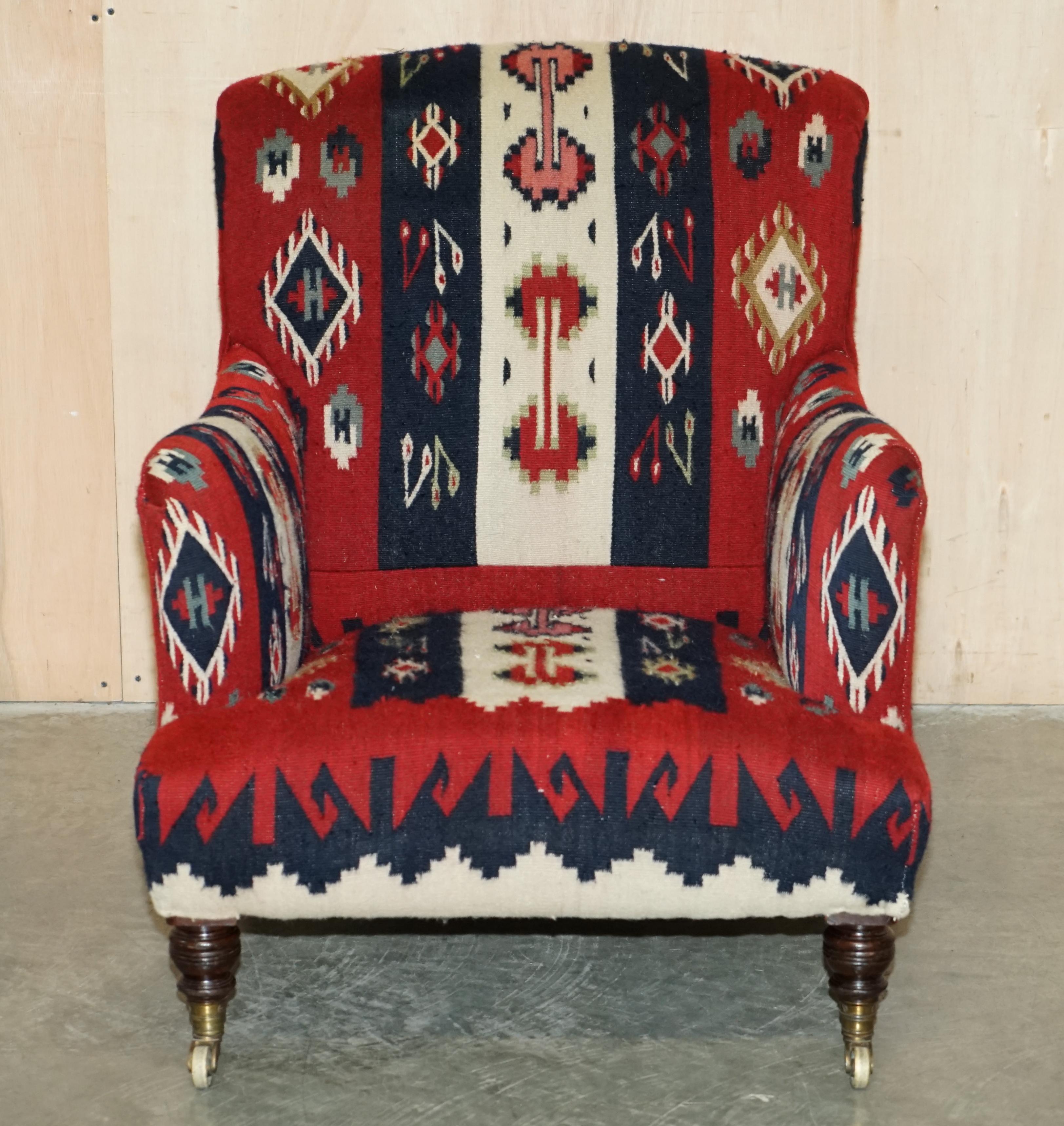 Victorian RARE ORIGINAL ViCTORIAN HOWARD & SONS BRIDGEWATER ARMCHAIR WITH KILIM UPHOLSTERY For Sale