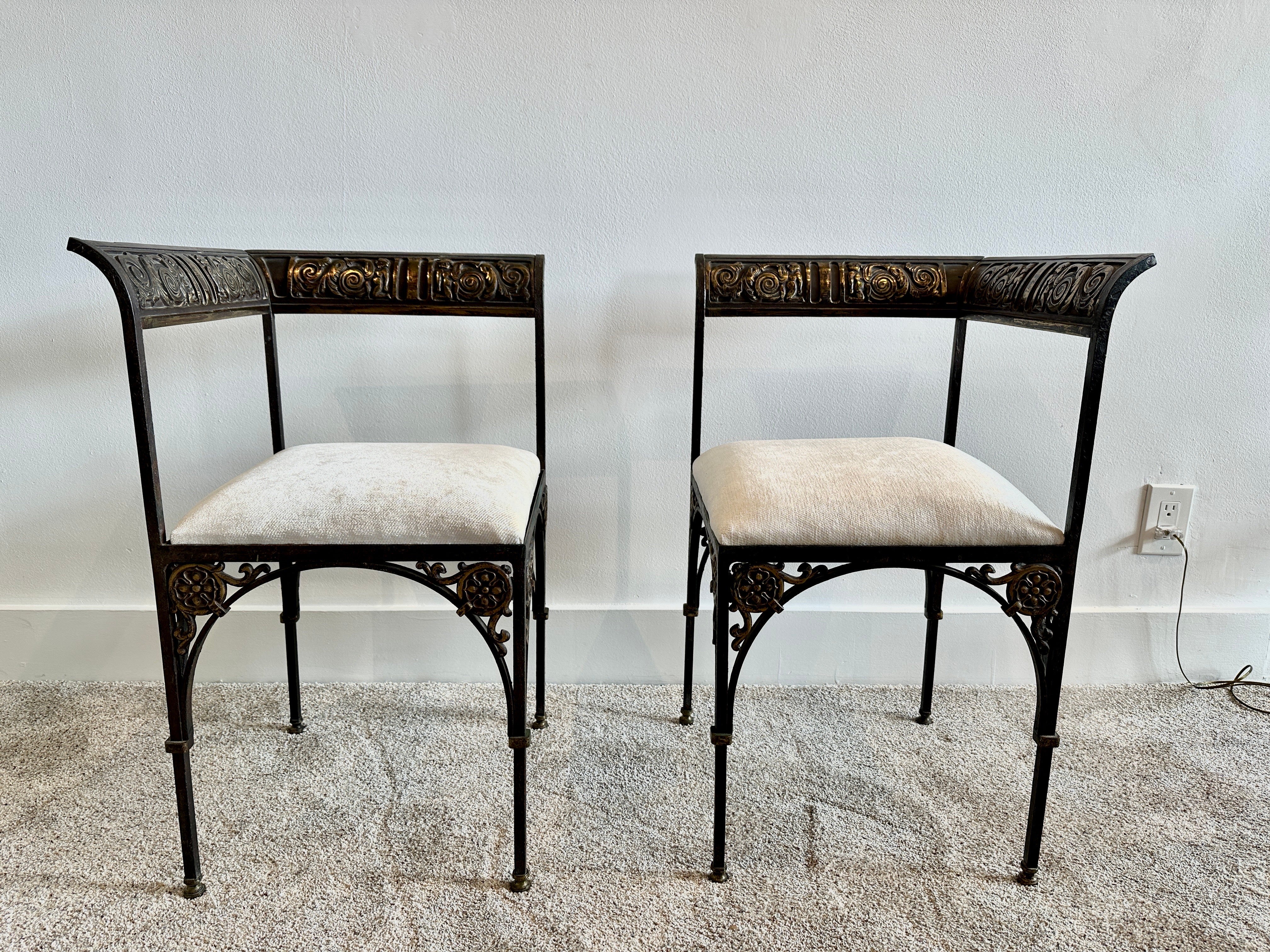Oscar Bruno Bach (German/American, 1884-1957) designed these lovely corner chairs in 1925 and yet, they have a timeless beauty and functionality. Beautiful bronze work to backrest and legs, along with wrought iron legs and structure. Original finish