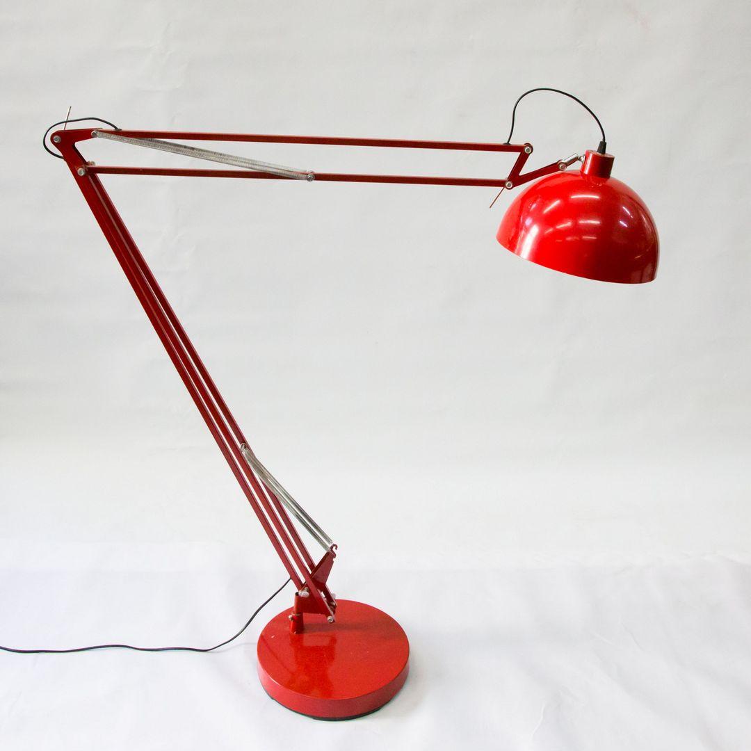 This is a very large format oversized lamp features extraordinary measures, meanwhile maintaining the design of a standard table lamp. It features a cast iron base, a red painted glossy surface and restored electricity.
  