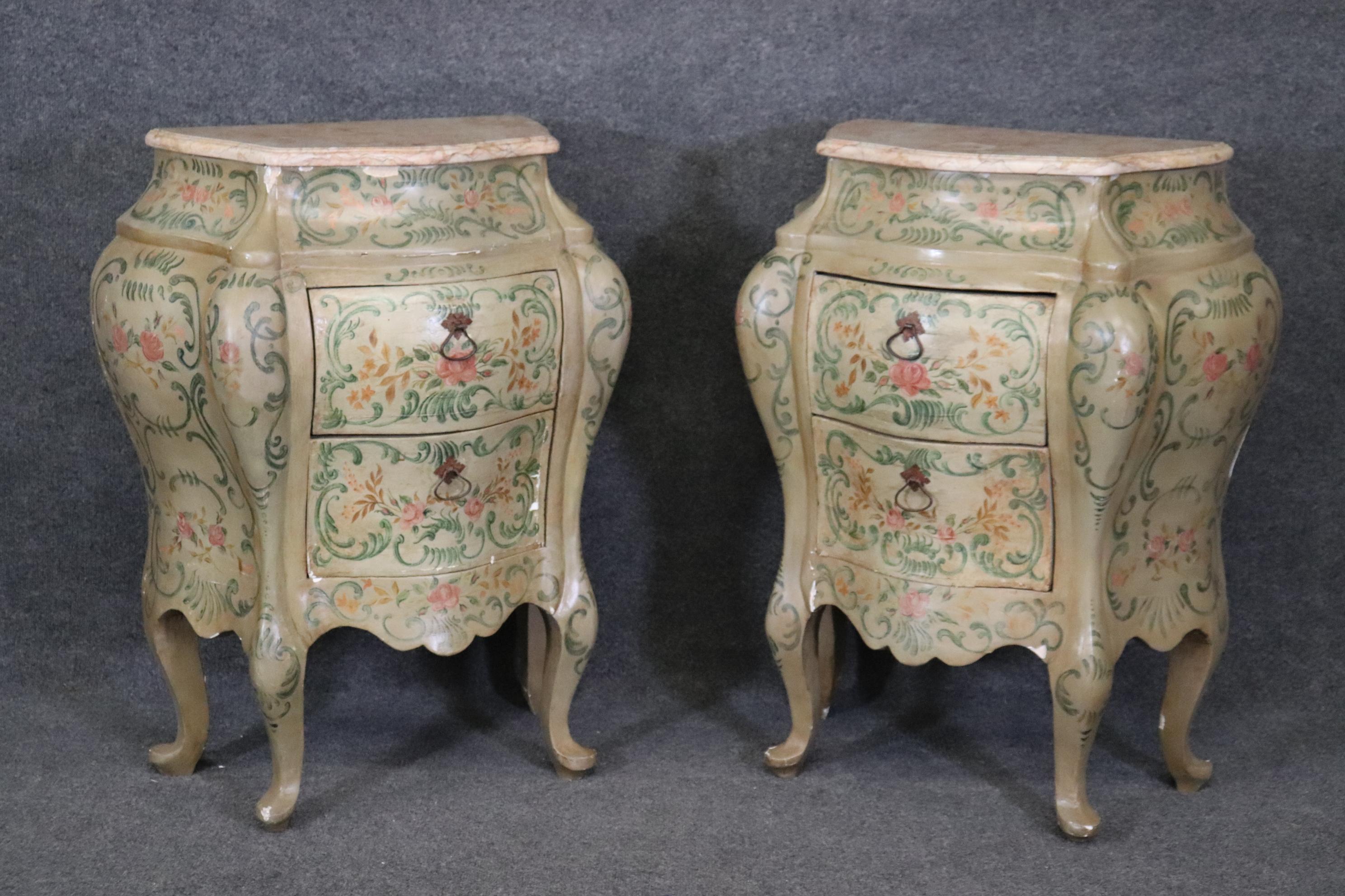 This is an extremely rare pair of original hand-painted Venetian paint decorated pair of nightstands. They are in good condition with some minor finish as to be expected for their advanced age. The stands are in good condition and they have a pair