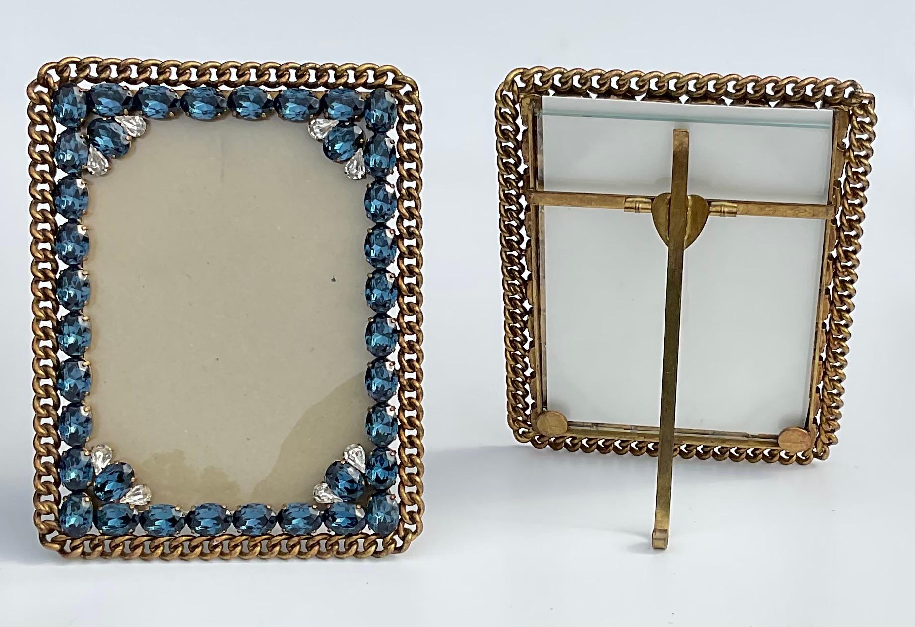 Very rare to find one, but a pair of these exceptional frames is almost impossible to find. Large blue stones, and smaller Clear stones really enhance the look of these frames. The metal is known as a wedding ring design which originated in England.