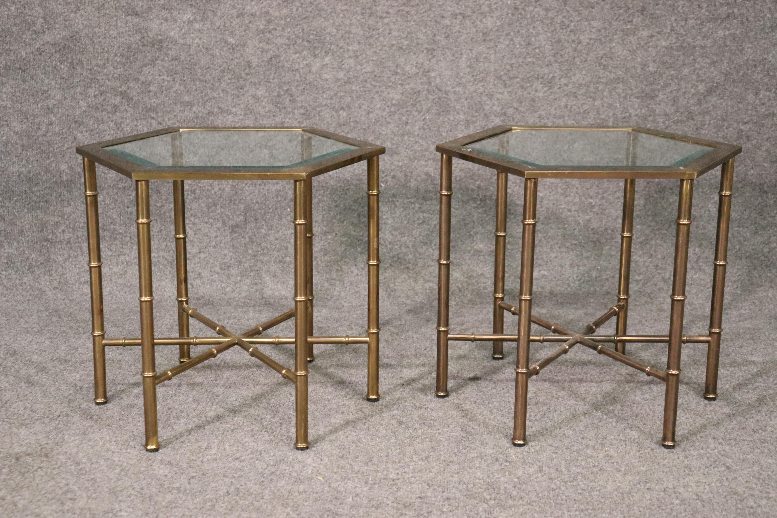 This is a gorgeous set of beautiful brass tables attributed to Bagues They are made of brass and in good original conditon. They measure 18 x 18 x 16 tall. They date to the 1960s era.