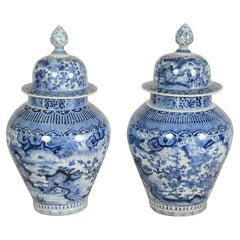 Rare Pair C17th Century Japanese Arita Blue and White porcelain lidded vases.