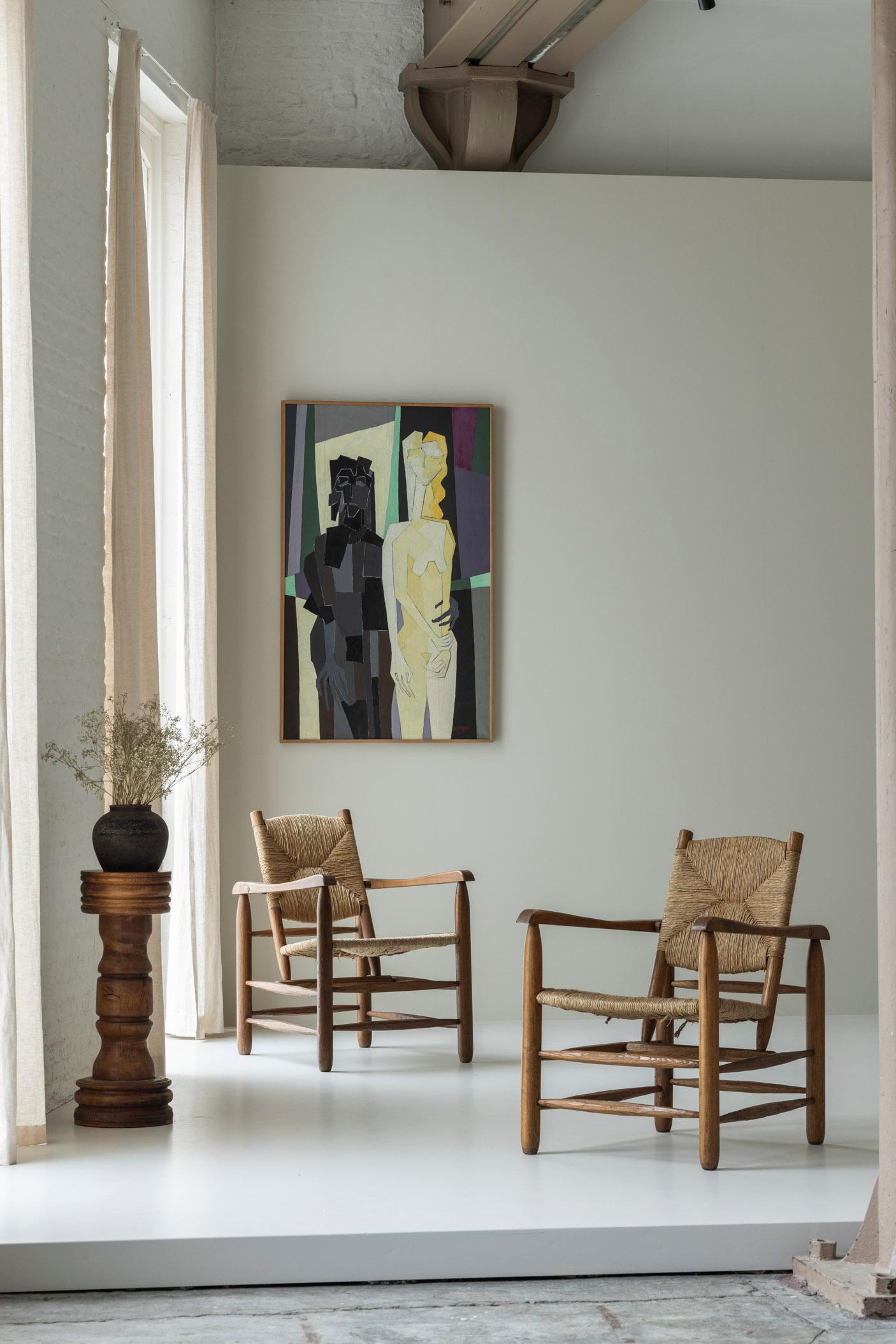 Very rare pair armchairs model ‘Chamrousse’ by Charlotte Perriand for Steph Simon, France 1940’s. These chairs are made out of ash and features straw seats and backs. Presented in its original and untouched condition preserving a beautiful overall