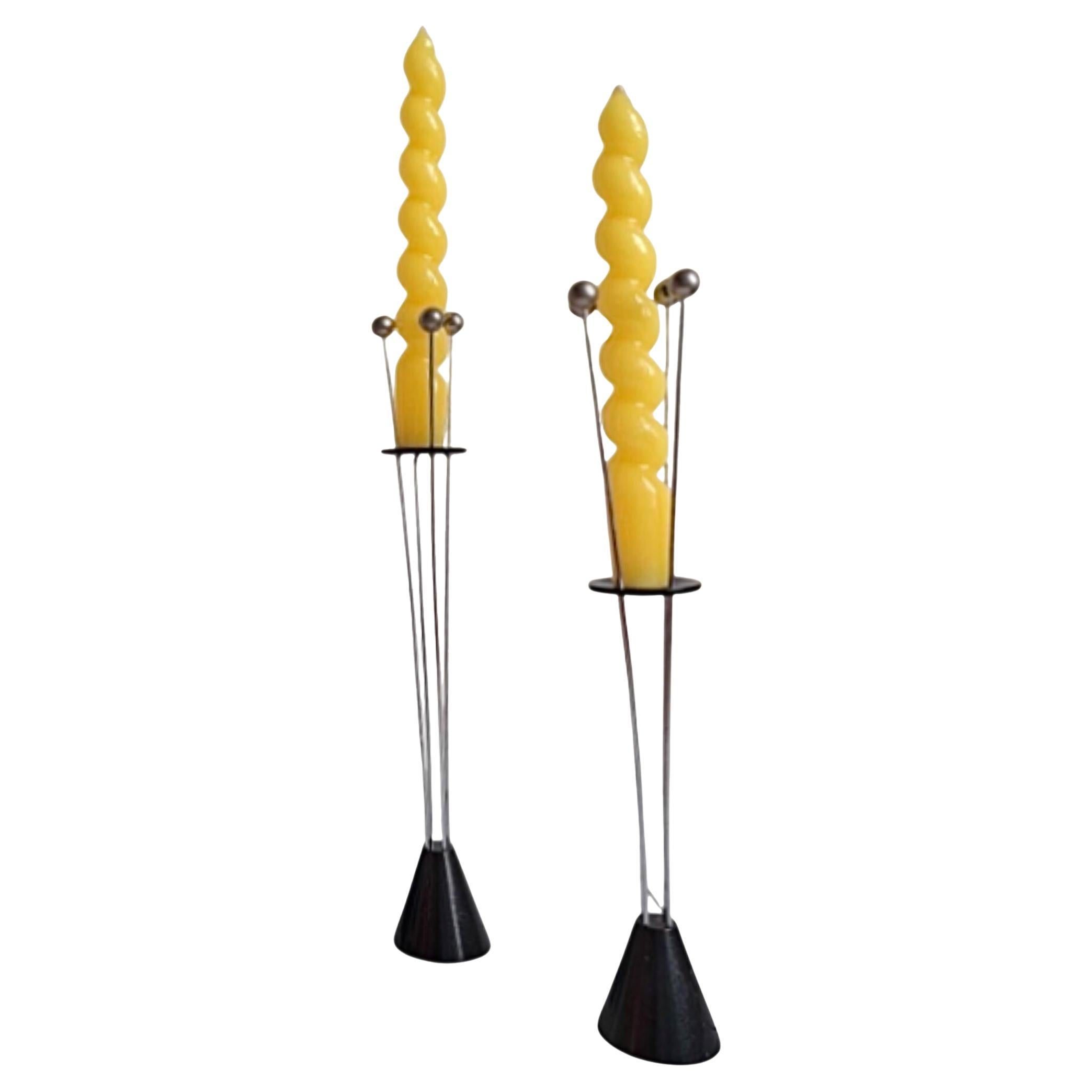 Very rare pair of Tall, Minimalist, Post Modern  Adjustable Height, Candle Holders.  Made in the Netherlands 

Beautiful lines and clever design. 

The disk that the candles rest upon can be adjusted up or down, allowing the candles to be displayed