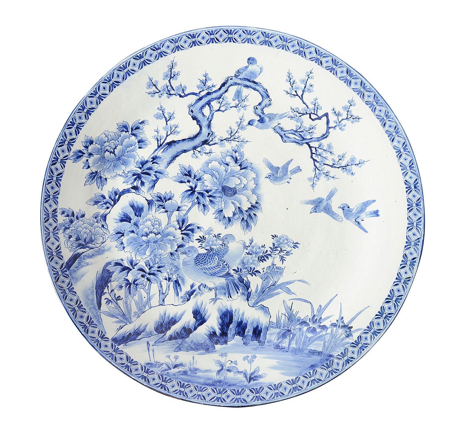 A rare and imposing pair of late 19th Century Japanese blue and white chargers, each depicting this scene of Doves flying among exotic flowers and blossom trees.


Batch 77 G216/23 DNUKZ C/C