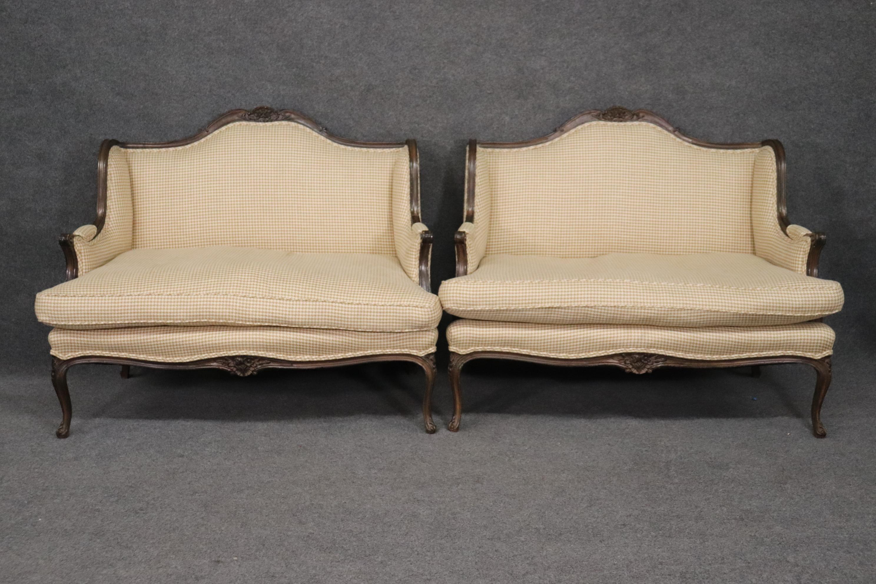 Bigger than a large bergere, smaller than a settee, and beautifully scaled for two people, this pair of French Louis XV style marquis are very unique in terms of size and styling. The pair measures 50 wide x 40 tall x 34 deep and the seat height is