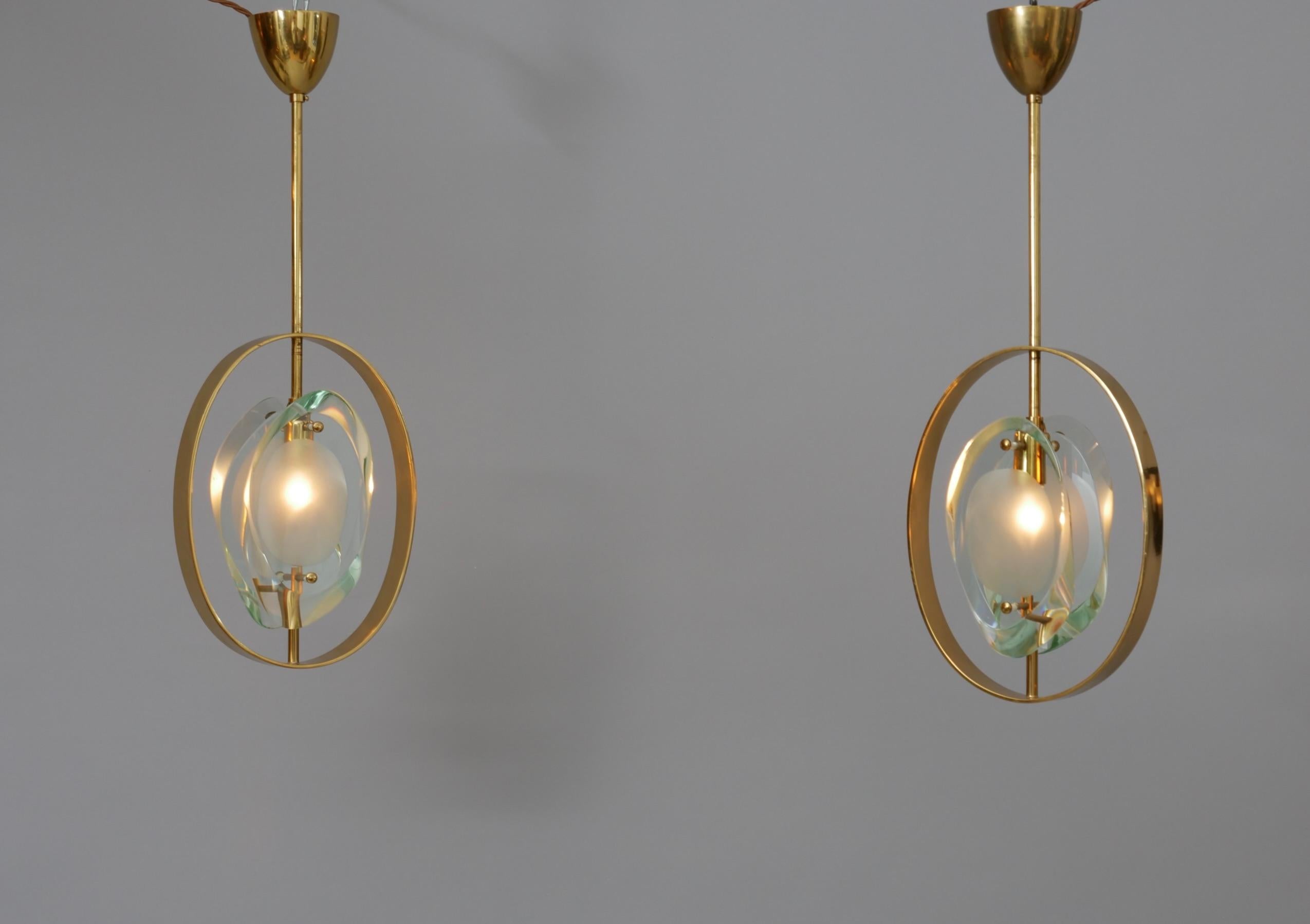 Rare pair original Max Ingrand pendents

Double lens cut panels of thick profiled polished glass with satin finished glass centres

In excellent condition. 

No chips or cracks. Lovely patina to brass